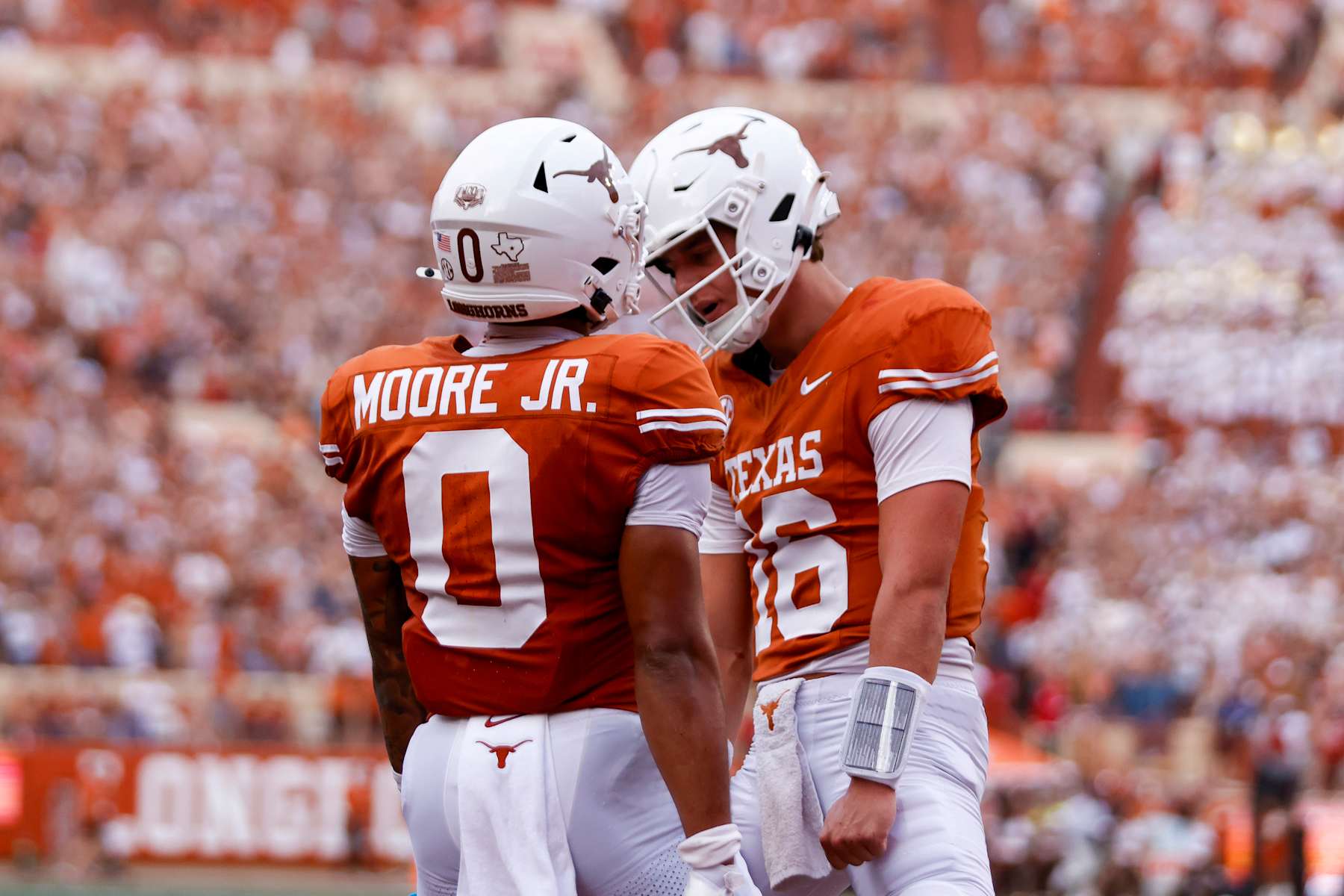 AUSTIN, TX - SEPTEMBER 14: Texas Longhorns quarterback Arch Manning (16)(R) celebrates with Texas Longhorns wide receiver DeAndre Moore Jr. (0)(L) after Moore scores a touchdown during the first half of the game against the UTSA Roadrunners on September 14, 2024, at Darrell K Royal - Texas Memorial Stadium in Austin, TX. (Photo by Adam Davis/Icon Sportswire via Getty Images)