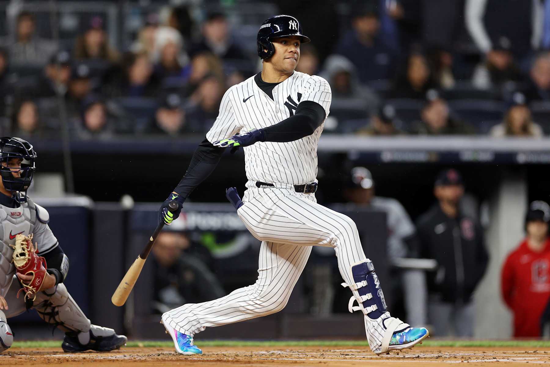 NEW YORK, NEW YORK - OCTOBER 15: Juan Soto #22 of the New York Yankees hits a single in the first inning against the Cleveland Guardians during Game Two of the American League Championship Series at Yankee Stadium on October 15, 2024 in New York City. (Photo by Elsa/Getty Images)