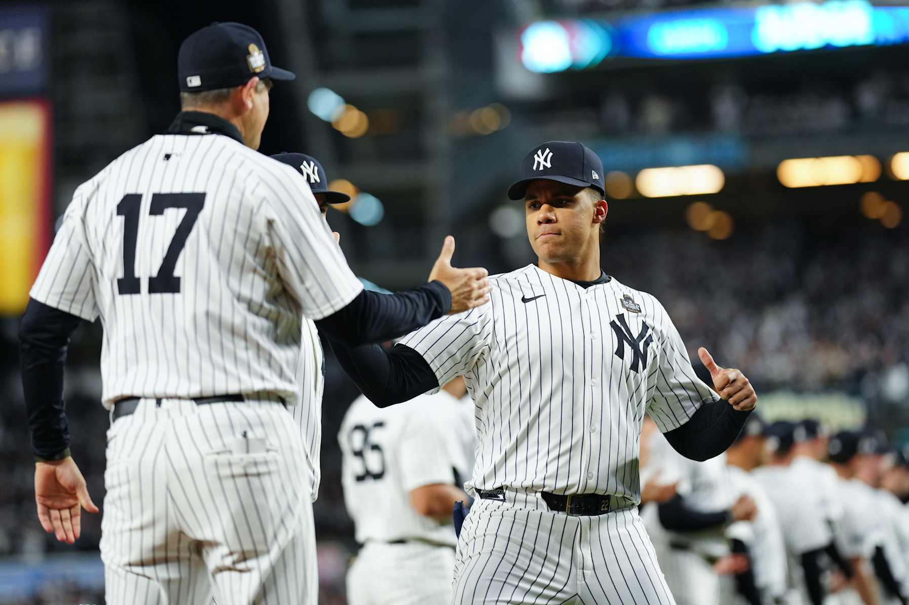 NEW YORK, NY - OCTOBER 28: Juan Soto #22 of the New York Yankees greets manager Aaron Boone #17 on the field prior to Game 3 of the 2024 World Series presented by Capital One between the Los Angeles Dodgers and the New York Yankees at Yankee Stadium on Monday, October 28, 2024 in New York, New York. (Photo by Daniel Shirey/MLB Photos via Getty Images)