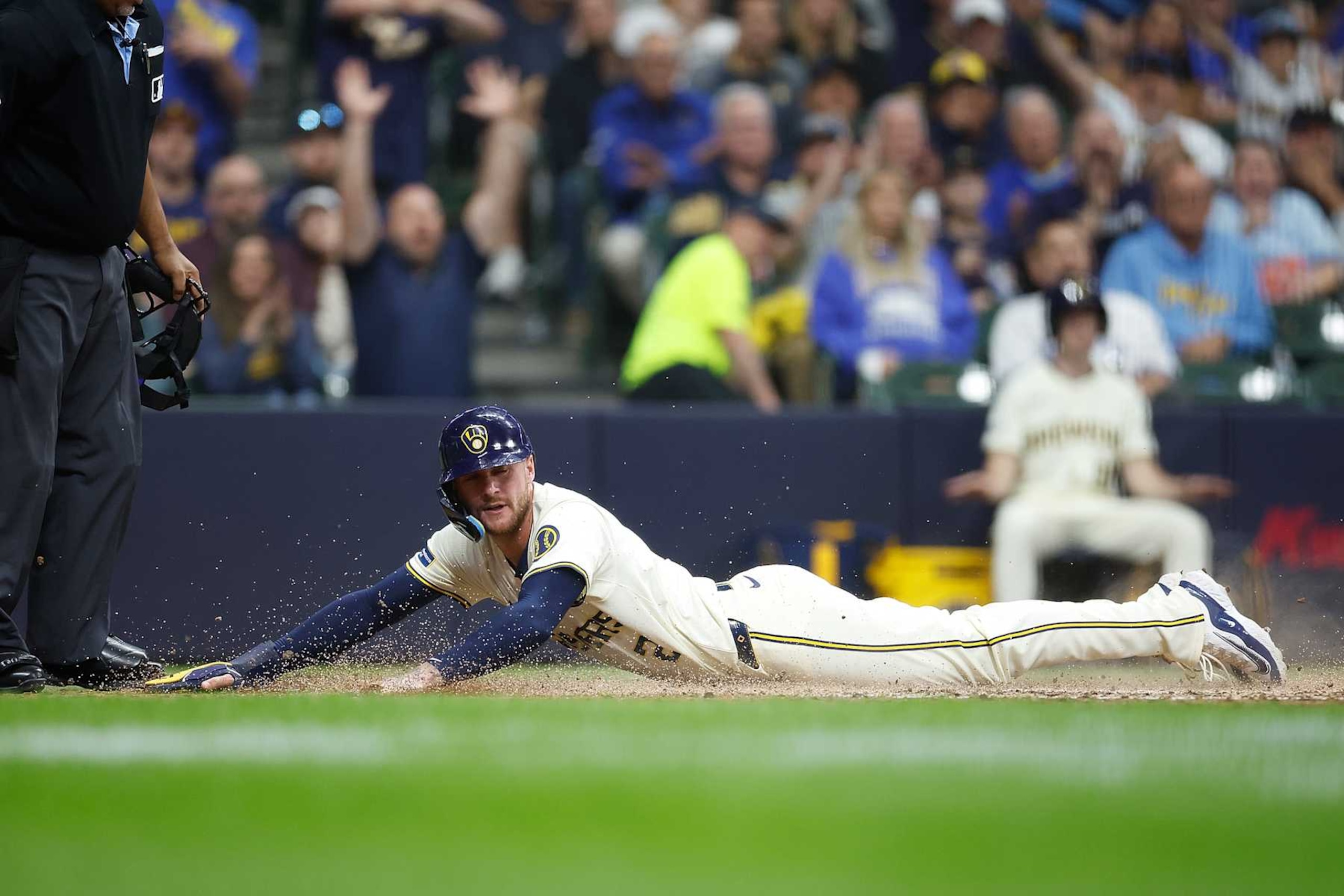 MILWAUKEE, WISCONSIN - JUNE 10: Brice Turang #2 of the Milwaukee Brewers slides safely into home plate on a sacrifice fly in the sixth inning a\t at American Family Field on June 10, 2024 in Milwaukee, Wisconsin. (Photo by John Fisher/Getty Images) MILWAUKEE, WISCONSIN - JUNE 10: Brice Turang #2 of the Milwaukee Brewers slides safely into home plate on a sacrifice fly in the sixth inning a\t at American Family Field on June 10, 2024 in Milwaukee, Wisconsin. (Photo by John Fisher/Getty Images)