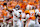 KNOXVILLE, TENNESSEE - OCTOBER 19:Jalen Milroe #4 of the Alabama Crimson Tide is hit by Dominic Bailey #90 of the Tennessee Volunteers as he throws the ball during the first half at Neyland Stadium on October 19, 2024 in Knoxville, Tennessee. (Photo by Butch Dill/Getty Images)