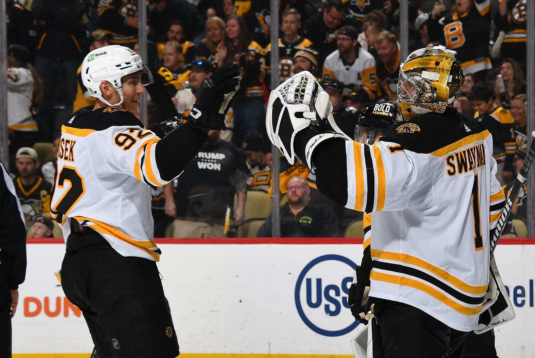 PITTSBURGH, PA - APRIL 01:  Jeremy Swayman #1 celebrates with Tomas Nosek #92 of the Boston Bruinsafter a 4-3 win over the Pittsburgh Penguins at PPG PAINTS Arena on April 1, 2023 in Pittsburgh, Pennsylvania. (Photo by Joe Sargent/NHLI via Getty Images)