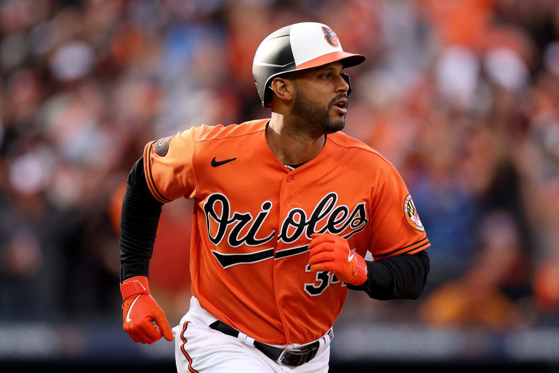 BALTIMORE, MARYLAND - OCTOBER 08: Aaron Hicks #34 of the Baltimore Orioles watches his two-run RBI single during the first inning against the Texas Rangers in Game Two of the Division Series at Oriole Park at Camden Yards on October 08, 2023 in Baltimore, Maryland. (Photo by Patrick Smith/Getty Images)