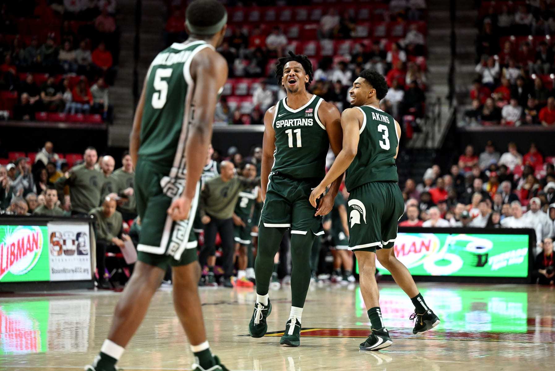 COLLEGE PARK, MARYLAND - JANUARY 21: A.J. Hoggard #11 of the Michigan State Spartans celebrates with Jaden Akins #3 during the game against the Maryland Terrapins at Xfinity Center on January 21, 2024 in College Park, Maryland. (Photo by G Fiume/Getty Images)