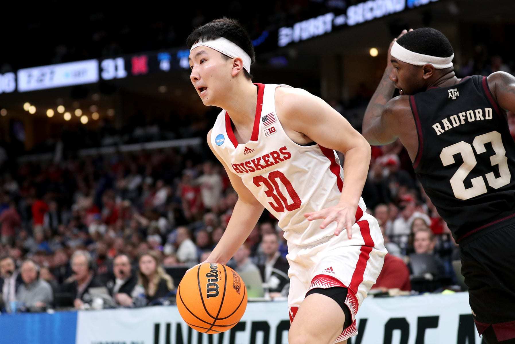 MEMPHIS, TENNESSEE - MARCH 22: Keisei Tominaga #30 of the Nebraska Cornhuskers drives to the basket against Tyrece Radford #23 of the Texas A&M Aggies during the first half in the first round of the NCAA Men's Basketball Tournament at FedExForum on March 22, 2024 in Memphis, Tennessee. (Photo by Justin Ford/Getty Images)