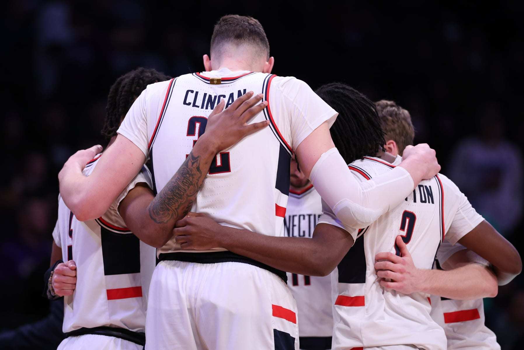 NEW YORK, NEW YORK - MARCH 24: Connecticut Huskies players huddle during the second half against the Northwestern Wildcats in the second round of the NCAA Men's Basketball Tournament at Barclays Center on March 24, 2024 in New York City. (Photo by Elsa/Getty Images)