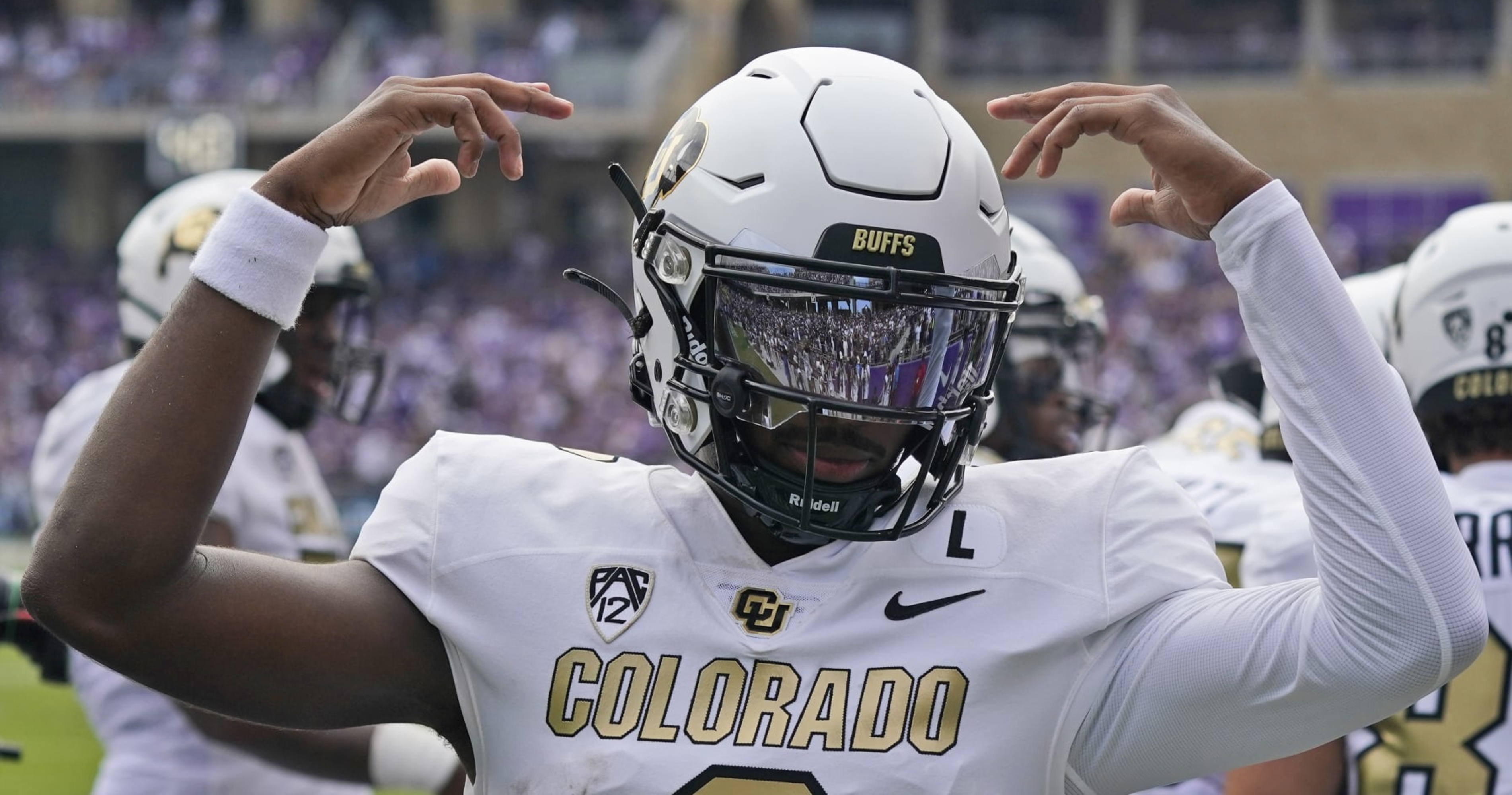 Coach Prime debuts new white and gold uniforms in Colorado debut