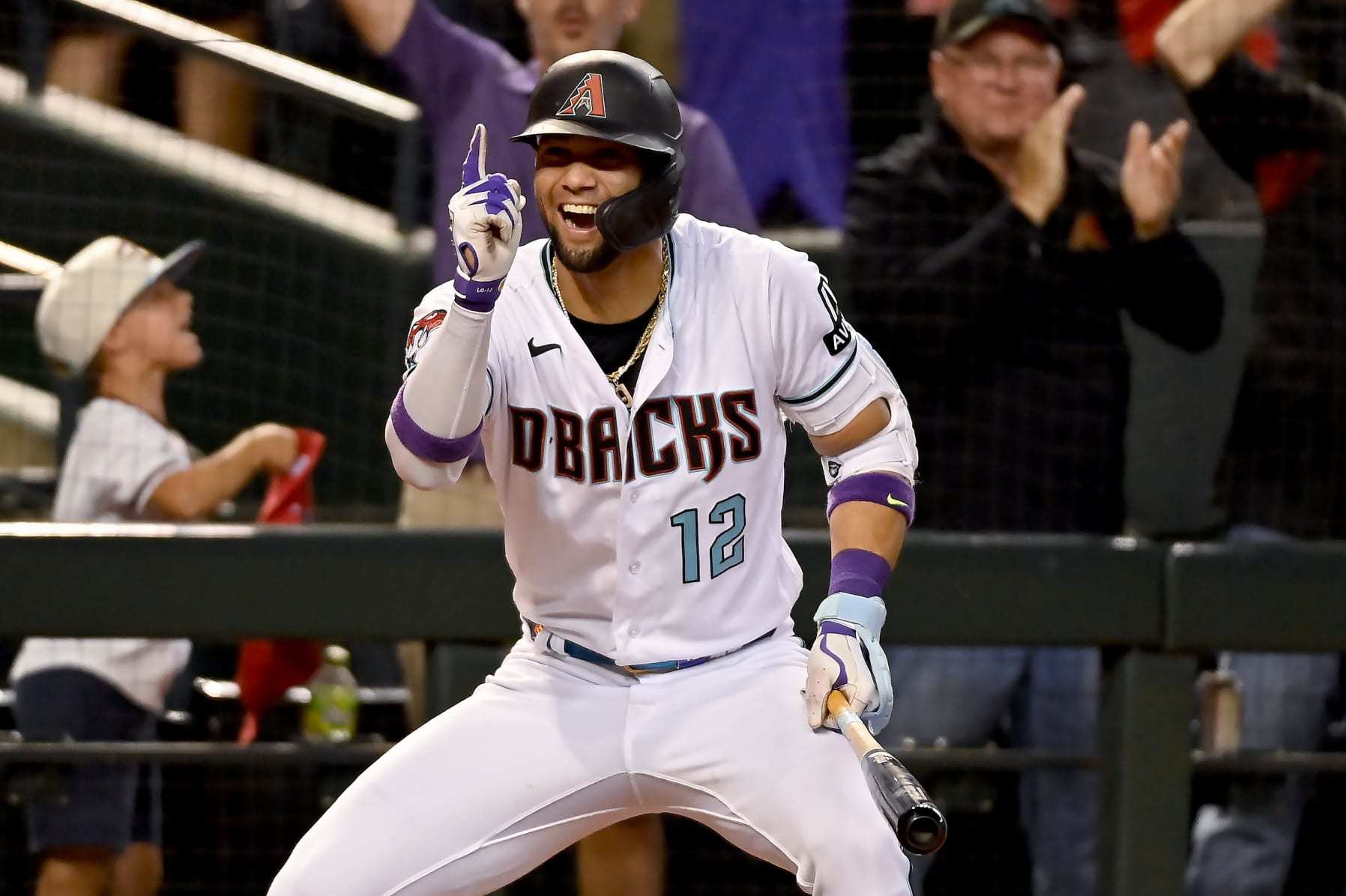 PHOENIX, ARIZONA - OCTOBER 11: Lourdes Gurriel Jr. #12 of the Arizona Diamondbacks celebrates after Gabriel Moreno #14 (not pictured) hit a home run in the third inning against the Los Angeles Dodgers during Game Three of the Division Series at Chase Field on October 11, 2023 in Phoenix, Arizona. (Photo by Norm Hall/Getty Images)