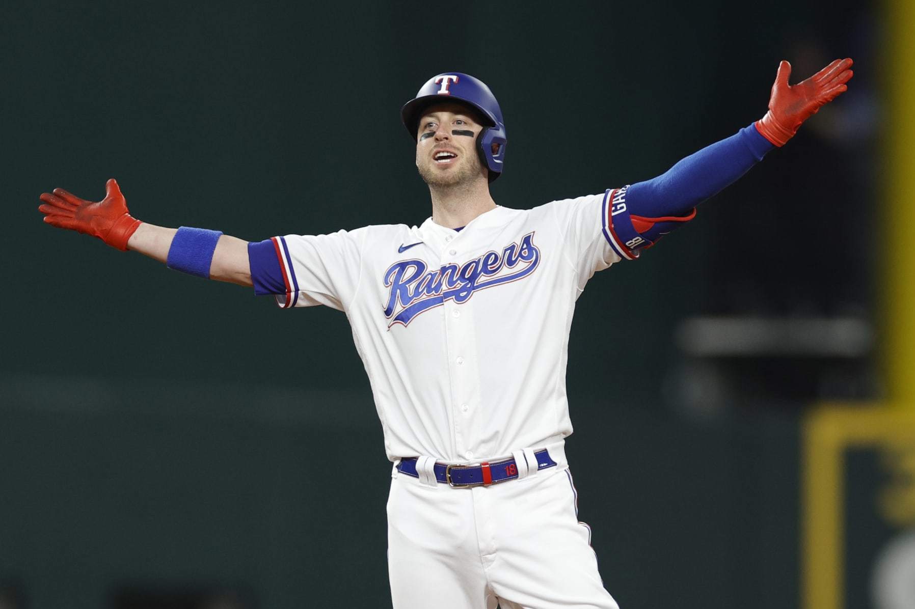 ARLINGTON, TEXAS - OCTOBER 10: Mitch Garver #18 of the Texas Rangers celebrates after hitting a two-run RBI double against the Baltimore Orioles during the second inning in Game Three of the Division Series at Globe Life Field on October 10, 2023 in Arlington, Texas. (Photo by Carmen Mandato/Getty Images)