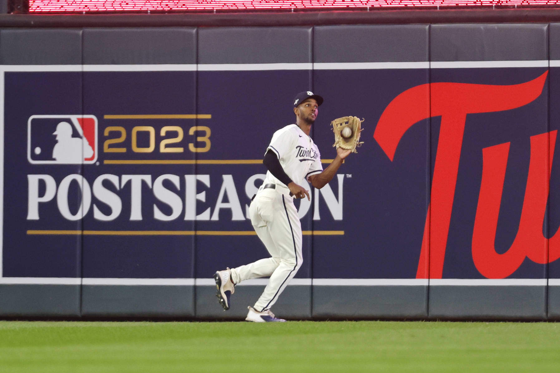 Minnesota Twins center fielder Michael A. Taylor catches the fly out hit by Houston Astros' Alex Bregman during the third inning of Game 4 of a baseball AL Division Series, Wednesday, Oct. 11, 2023, in Minneapolis. (AP Photo/Bruce Kluckhohn)