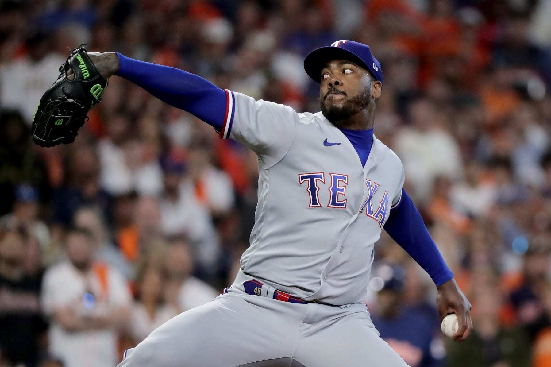 HOUSTON, TEXAS - OCTOBER 16: Aroldis Chapman #45 of the Texas Rangers throws a pitch against the Houston Astros during the eighth inning in Game Two of the American League Championship Series at Minute Maid Park on October 16, 2023 in Houston, Texas. (Photo by Bob Levey/Getty Images)