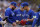 Toronto Blue Jays manager John Schneider, left, takes the ball from pitcher Jose Berrios during a pitching change in the fourth inning of Game 2 of an AL wild-card baseball playoff series against the Minnesota Twins Wednesday, Oct. 4, 2023, in Minneapolis. (AP Photo/Abbie Parr)