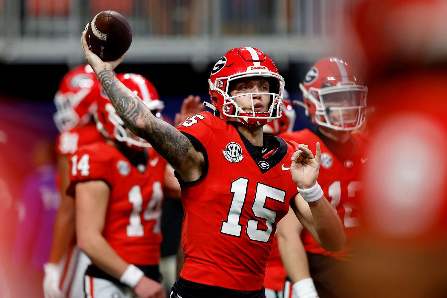 ATLANTA, GEORGIA - DECEMBER 07: Carson Beck #15 of the Georgia Bulldogs warms up prior to the 2024 SEC Championship against the Texas Longhorns at Mercedes-Benz Stadium on December 07, 2024 in Atlanta, Georgia. (Photo by Butch Dill/Getty Images)