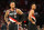 PORTLAND, OREGON - OCTOBER 27: Damian Lillard #0 of the Portland Trail Blazers and CJ McCollum #3 react against the Memphis Grizzlies during the third quarter at Moda Center on October 27, 2021 in Portland, Oregon. NOTE TO USER: User expressly acknowledges and agrees that, by downloading and or using this photograph, User is consenting to the terms and conditions of the Getty Images License Agreement. (Photo by Abbie Parr/Getty Images)