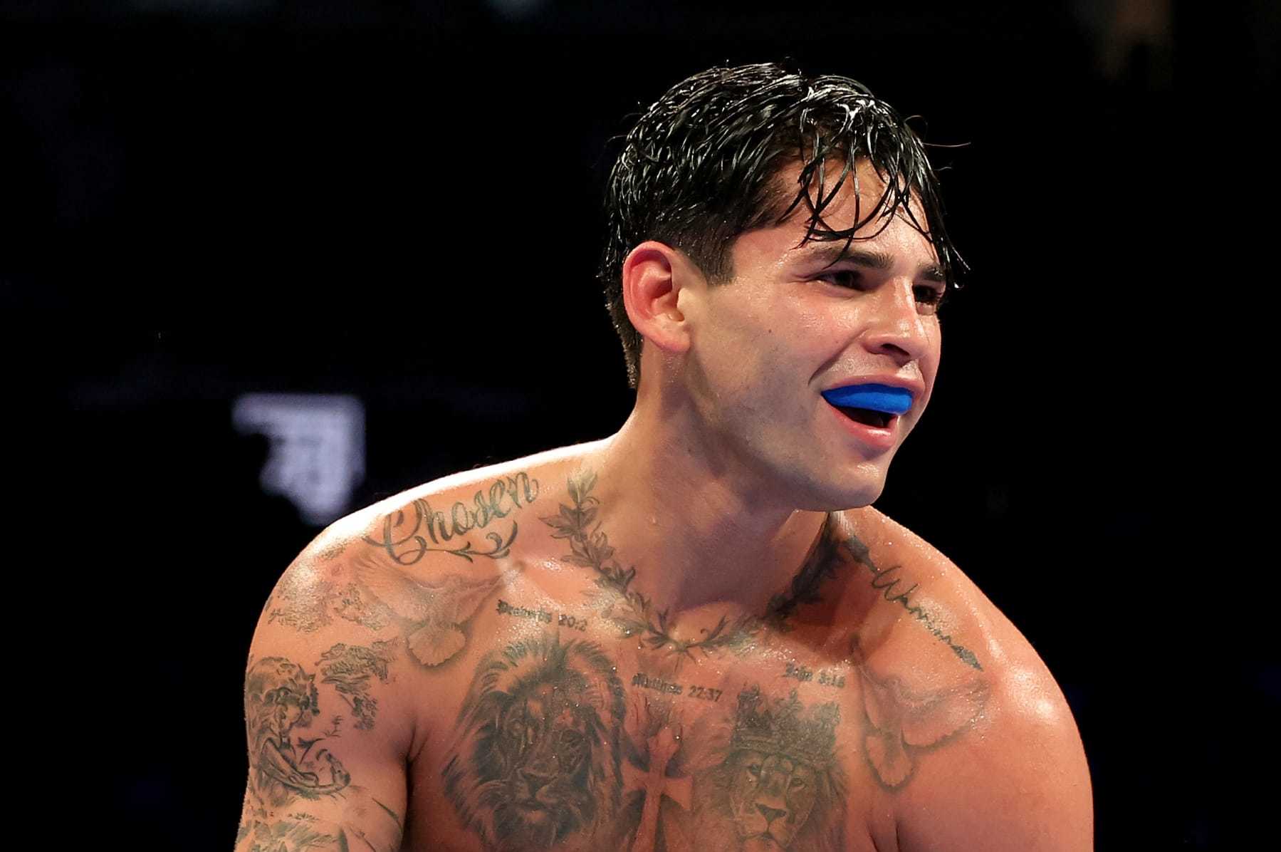 NEW YORK, NEW YORK - APRIL 20: Ryan Garcia (white trunks) reacts against Devin Haney (gray trunks) during their WBC Super Lightweight title bout at Barclays Center on April 20, 2024 in New York City.  (Photo by Al Bello/Getty Images)