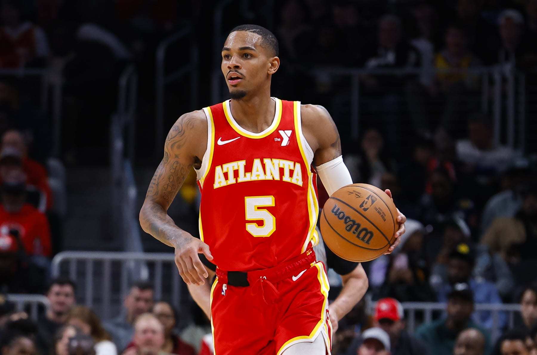 ATLANTA, GEORGIA - JANUARY 3: Dejounte Murray #5 of the Atlanta Hawks looks to pass during the second half against the Oklahoma City Thunder at State Farm Arena on January 3, 2024 in Atlanta, Georgia. NOTE TO USER: User expressly acknowledges and agrees that, by downloading and or using this photograph, User is consenting to the terms and conditions of the Getty Images License Agreement. (Photo by Todd Kirkland/Getty Images)