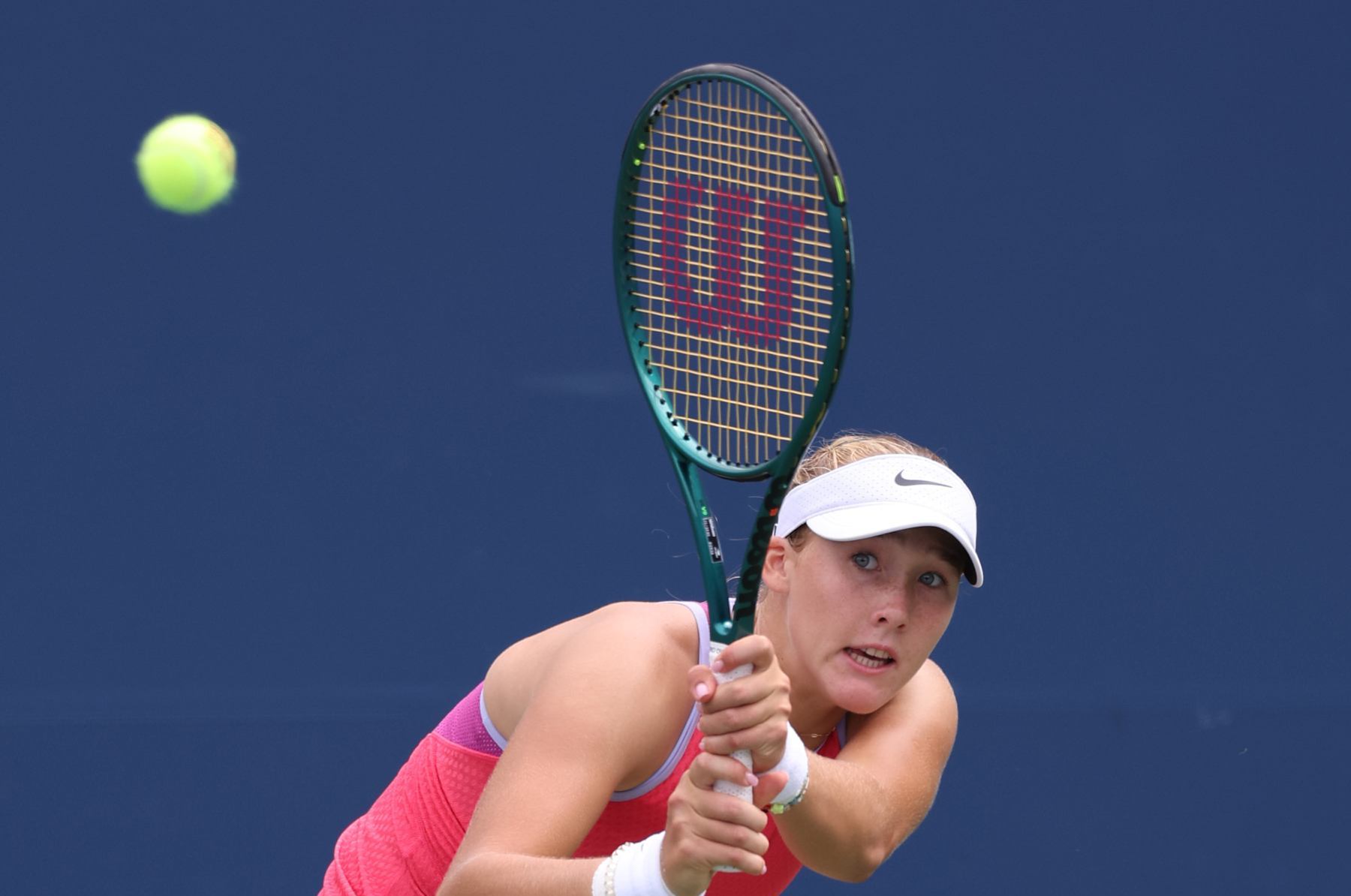 NEW YORK, NEW YORK - AUGUST 29: Mirra Andreeva of Russia returns a shot against Ashlyn Krueger of the United States during their Women's Singles Second Round match on Day Four of the 2024 US Open at USTA Billie Jean King National Tennis Center on August 29, 2024 in the Flushing neighborhood of the Queens borough of New York City. (Photo by Jamie Squire/Getty Images)