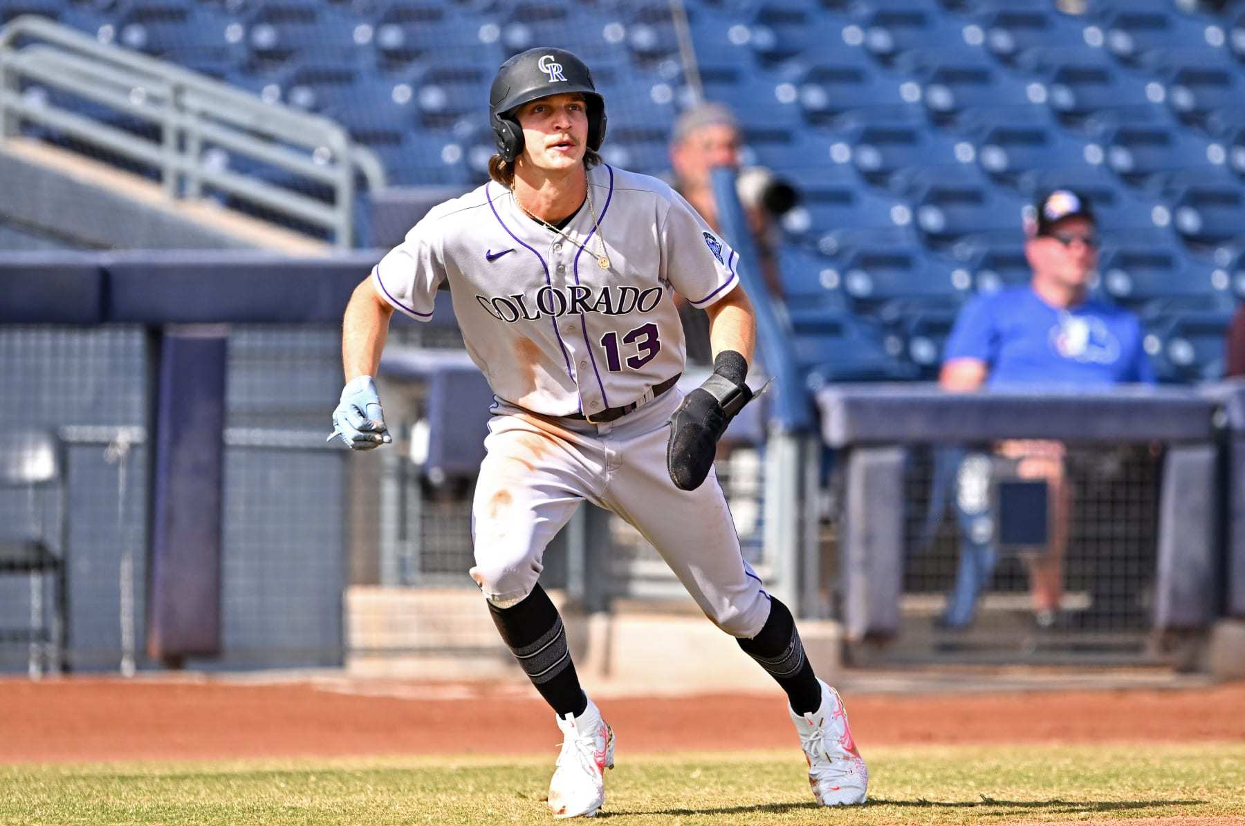 Colorado Rockies' Zac Veen (73) scores past Seattle Mariners