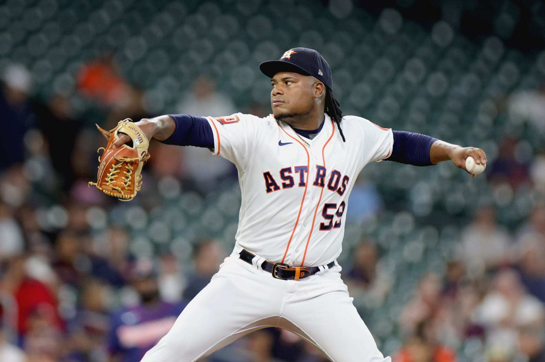 HOUSTON, TX - MAY 22: Houston Astros starting pitcher Jose Urquidy (65)  throws the ball to first base in the top of the first inning during the  baseball game between the Texas