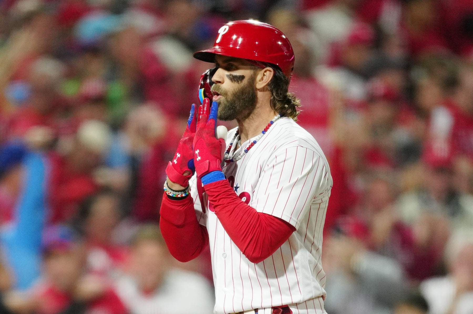 Phillies' Bryce Harper Signs His Helmet for a Young Fan After Being Ejected