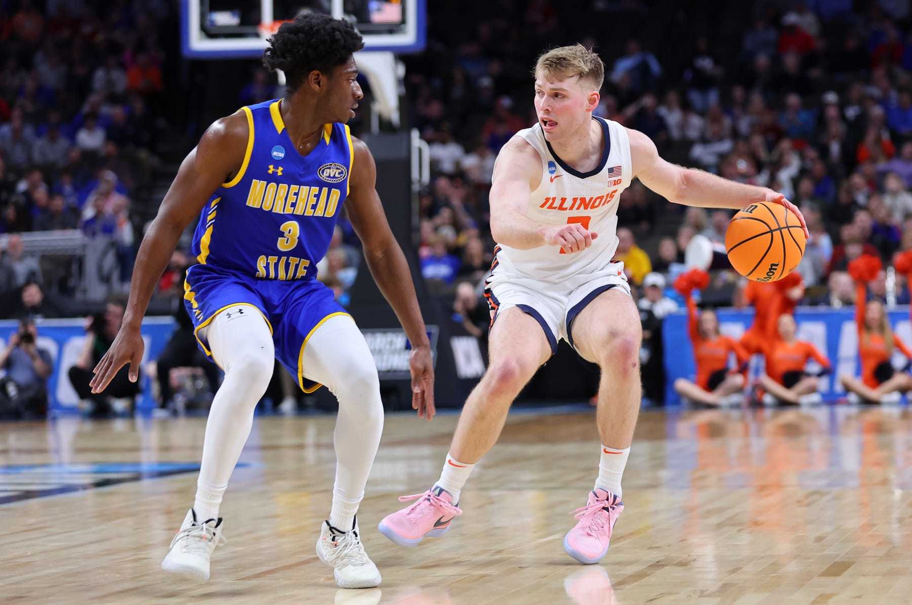 OMAHA, NEBRASKA - MARCH 21: Marcus Domask #3 of the Illinois Fighting Illini drives the ball around Drew Thelwell #3 of the Morehead State Eagles during the first half in the first round of the NCAA Men's Basketball Tournament at CHI Health Center on March 21, 2024 in Omaha, Nebraska. (Photo by Michael Reaves/Getty Images)