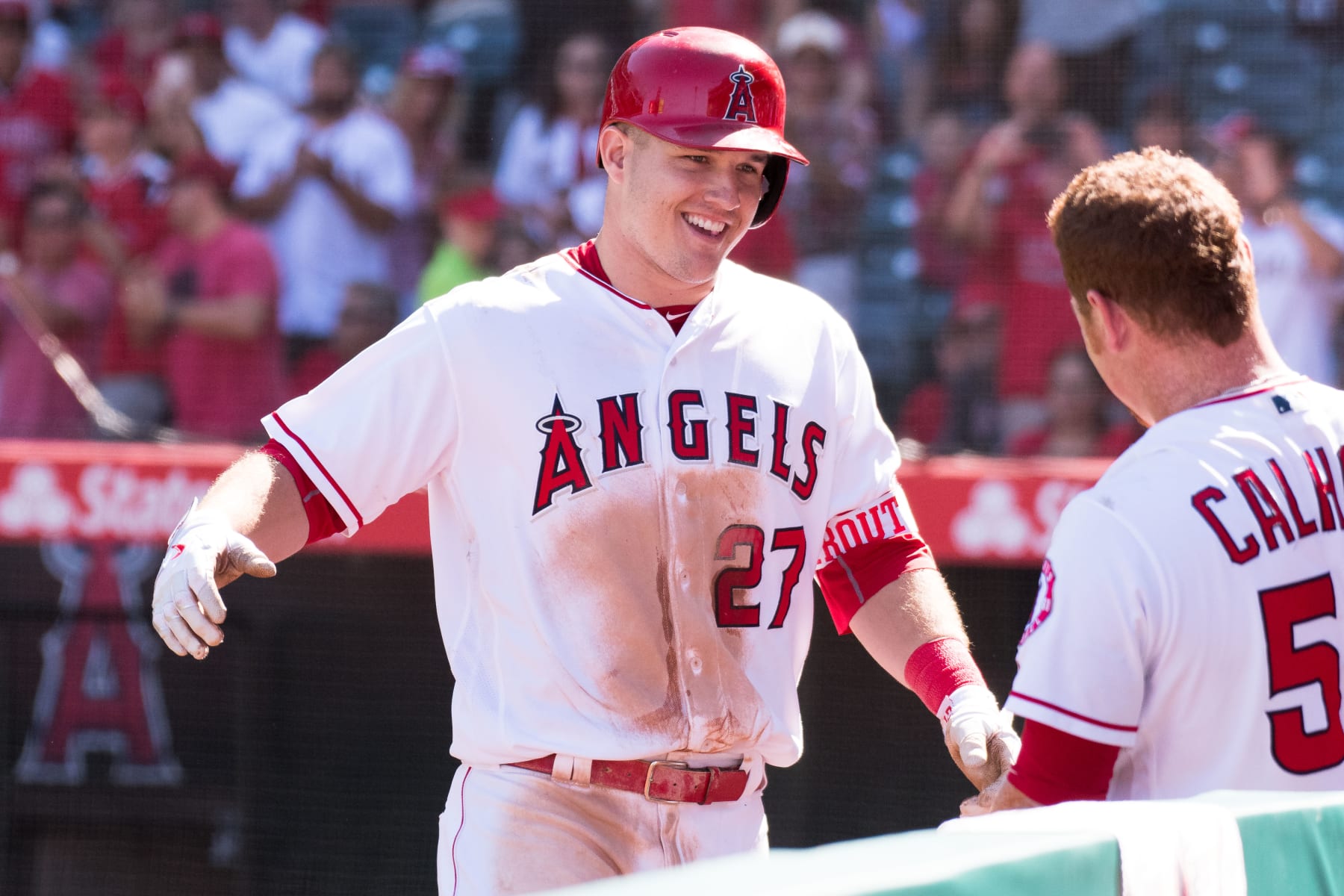 02 October 2016: Los Angeles Angels of Anaheim Center field Mike Trout (27) greeted by Los Angeles Angels of Anaheim Right field Kole Calhoun (56) after being lifted for a pinch running after he drove in a run for his 100th RBI of the season during the game against the Houston Astros played at Angel Stadium of Anaheim in Anaheim, CA. (Photo by Brian Rothmuller/Icon Sportswire via Getty Images)