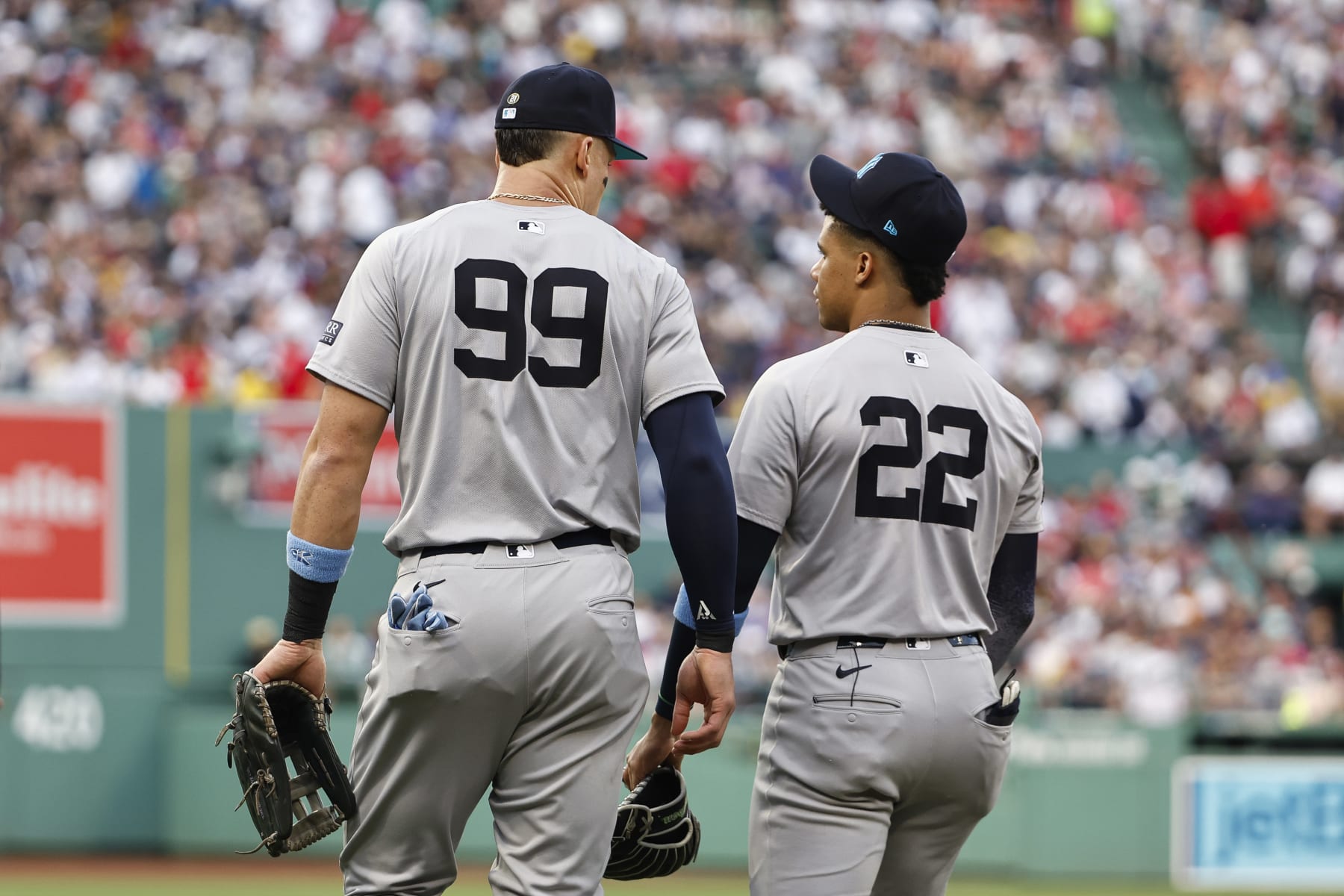 BOSTON, MA - JUNE 16: Aaron Judge #99 of the New York Yankees and Juan Soto #22 talk as they head to the field during the first inning against the Boston Red Sox at Fenway Park on June 16, 2024 in Boston, Massachusetts. (Photo By Winslow Townson/Getty Images)