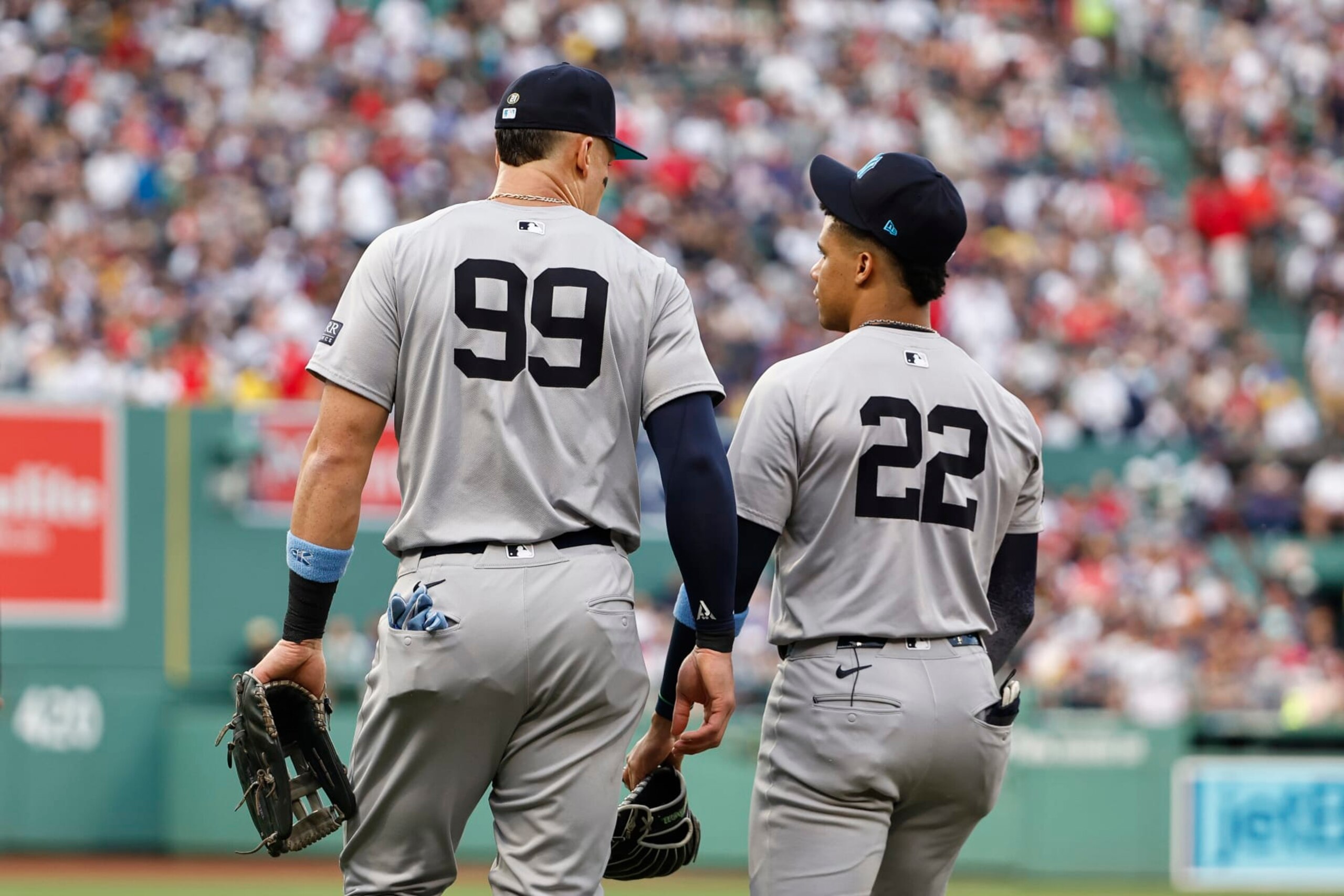 BOSTON, MA - JUNE 16: Aaron Judge #99 of the New York Yankees and Juan Soto #22 talk as they head to the field during the first inning against the Boston Red Sox at Fenway Park on June 16, 2024 in Boston, Massachusetts. (Photo By Winslow Townson/Getty Images)