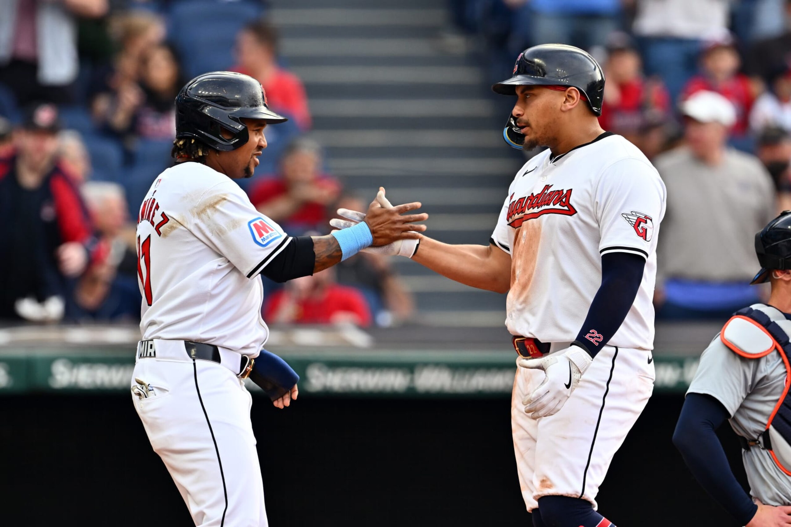 CLEVELAND, OHIO - MAY 07: José Ramírez #11 celebrates with Josh Naylor #22 of the Cleveland Guardians after both scored on a homer by Naylor during the second inning against the Detroit Tigers at Progressive Field on May 07, 2024 in Cleveland, Ohio. (Photo by Jason Miller/Getty Images)