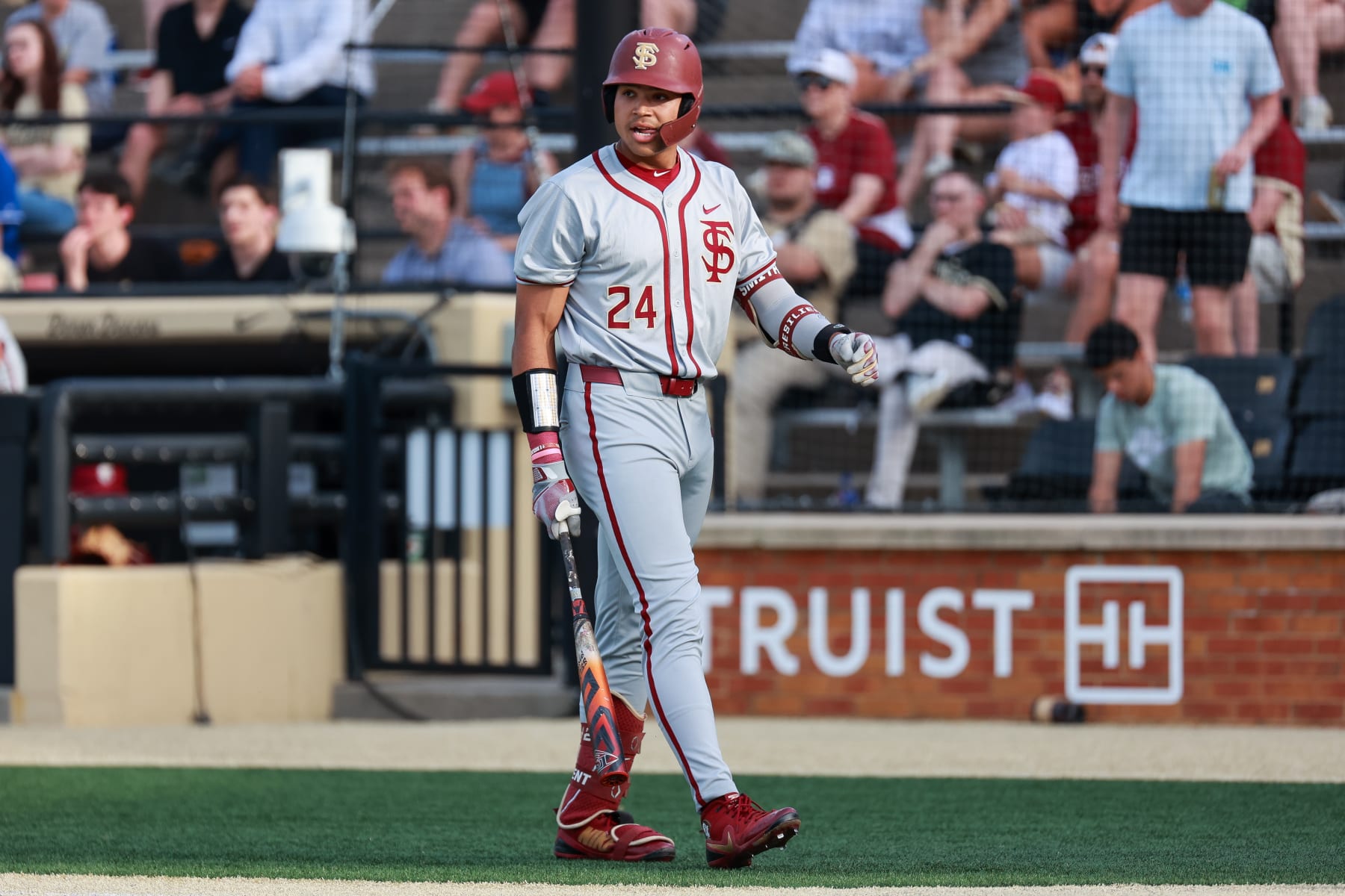 WINSTON SALEM, NORTH CAROLINA - APRIL 19: Cam Smith #24 of the Florida State Seminoles looks on before batting against the Wake Forest Demon Deacons at David F. Couch Ballpark on April 19, 2024 in Winston Salem, North Carolina. (Photo by Isaiah Vazquez/Getty Images)