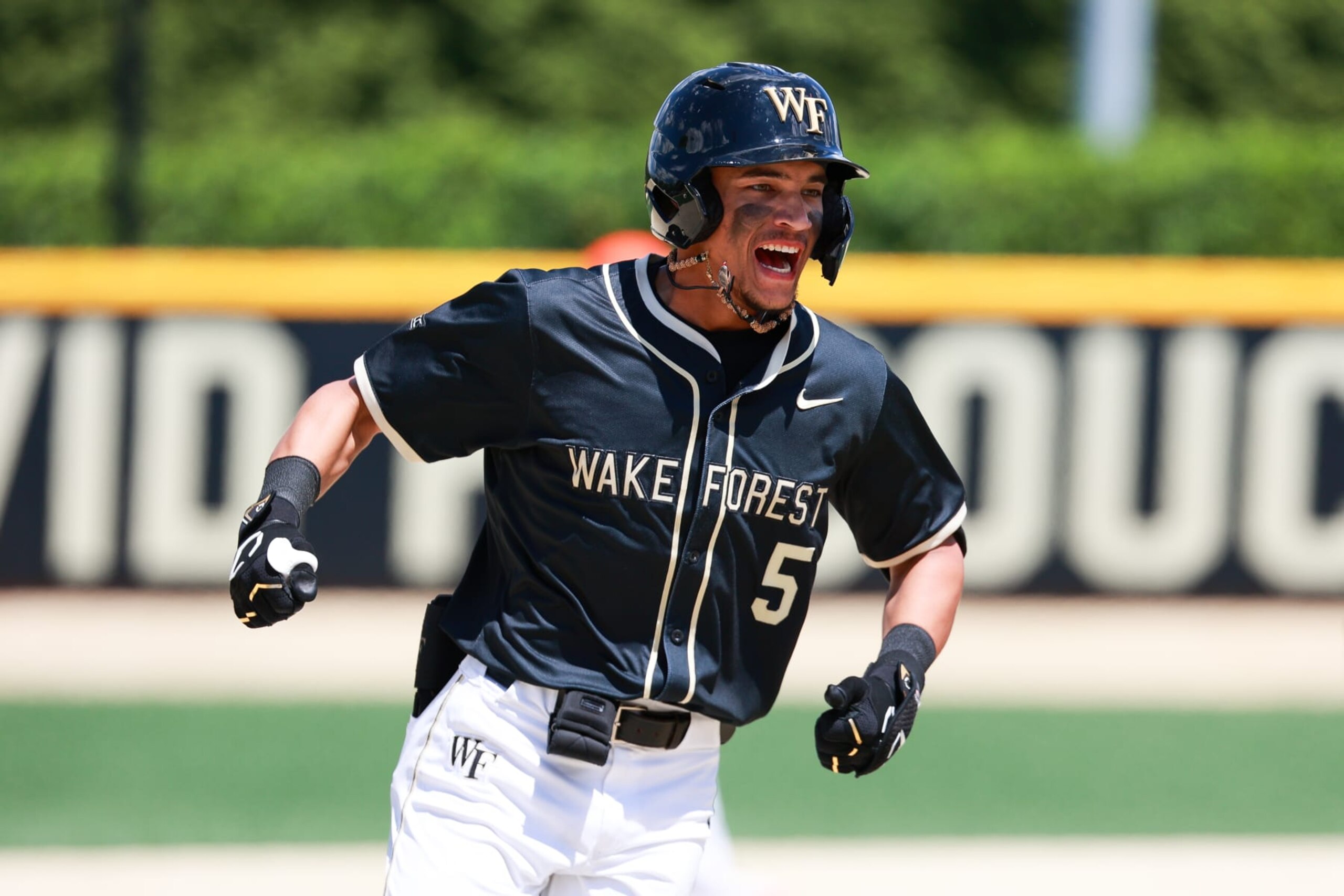 WINSTON SALEM, NORTH CAROLINA - MAY 12: Seaver King #5 of the Wake Forest Demon Deacons reacts after hitting a walk-off home run during the eighth inning to run-rule the Clemson Tigers, 13-3, at David F. Couch Ballpark on May 12, 2024 in Winston Salem, North Carolina. (Photo by Isaiah Vazquez/Getty Images)