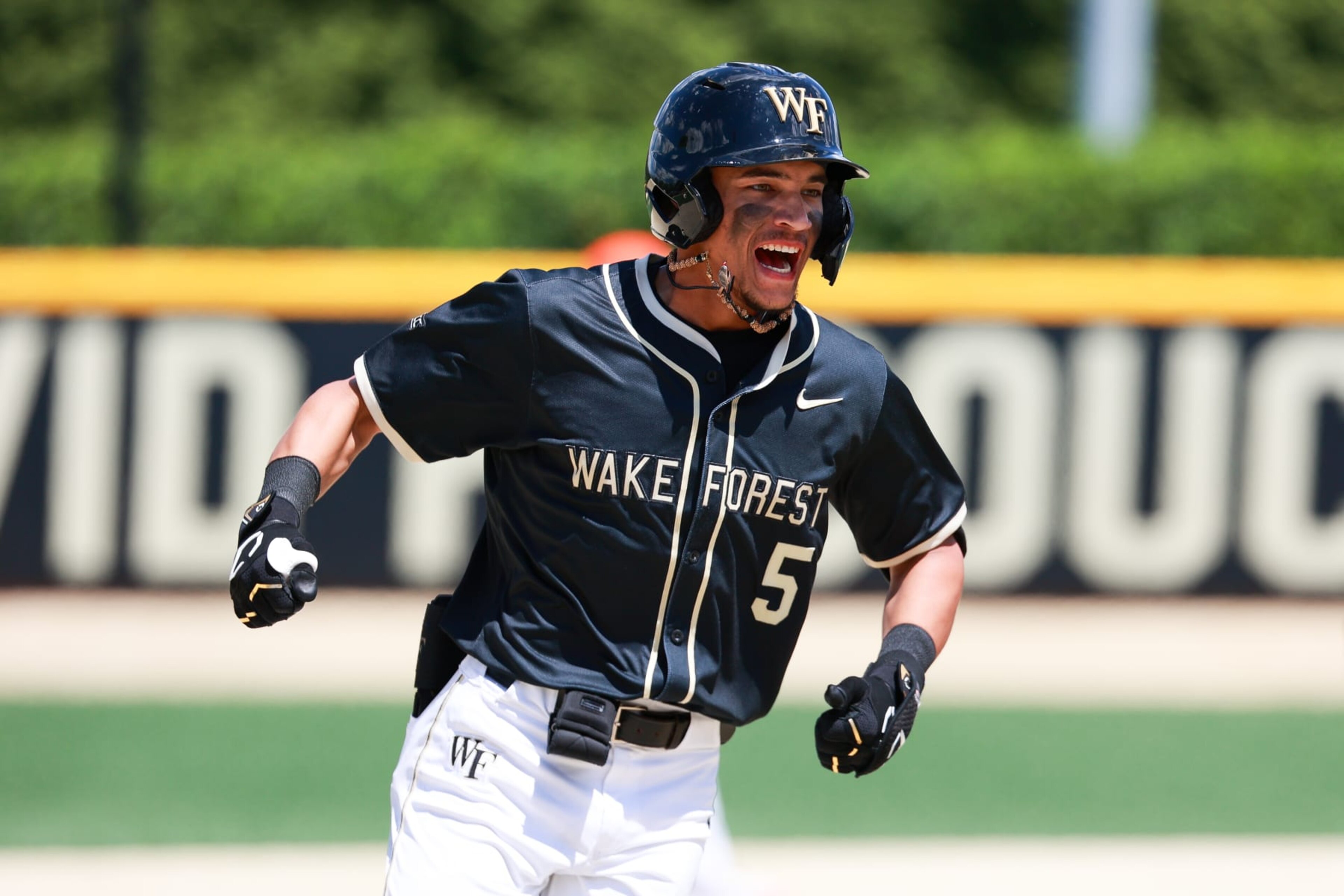 WINSTON SALEM, NORTH CAROLINA - MAY 12: Seaver King #5 of the Wake Forest Demon Deacons reacts after hitting a walk-off home run during the eighth inning to run-rule the Clemson Tigers, 13-3, at David F. Couch Ballpark on May 12, 2024 in Winston Salem, North Carolina. (Photo by Isaiah Vazquez/Getty Images)