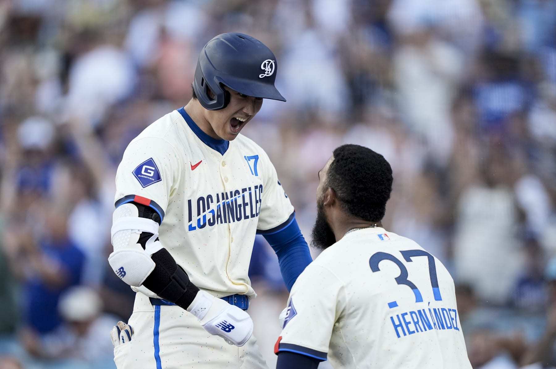 LOS ANGELES, CALIFORNIA - JULY 06: Shohei Ohtani #17 of the Los Angeles Dodgers celebrates with his teammate Teoscar Hernández #37 after hitting a solo home run against the Milwaukee Brewers during the eighth inning at Dodger Stadium on July 06, 2024 in Los Angeles, California. (Photo by Michael Owens/Getty Images) LOS ANGELES, CALIFORNIA - JULY 06: Shohei Ohtani #17 of the Los Angeles Dodgers celebrates with his teammate Teoscar Hernández #37 after hitting a solo home run against the Milwaukee Brewers during the eighth inning at Dodger Stadium on July 06, 2024 in Los Angeles, California. (Photo by Michael Owens/Getty Images)