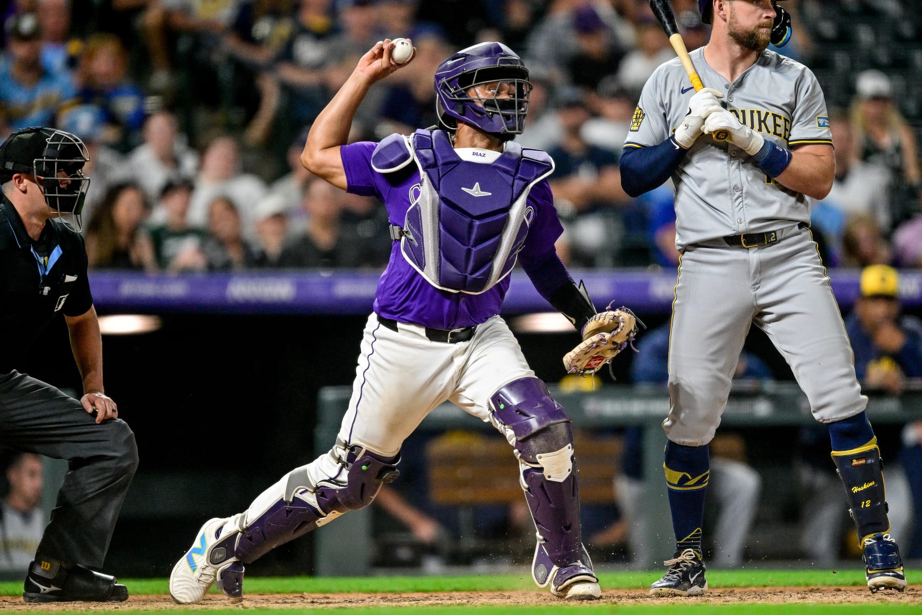 DENVER, CO - JULY: 01: Colorado Rockies catcher Elias Diaz (35) attempts to pick off a baserunner at second base in the 10th inning during a game between the Milwaukee Brewers and the Colorado Rockies at Coors Field on July 1, 2024 in Denver, Colorado. (Photo by Dustin Bradford/Icon Sportswire via Getty Images)