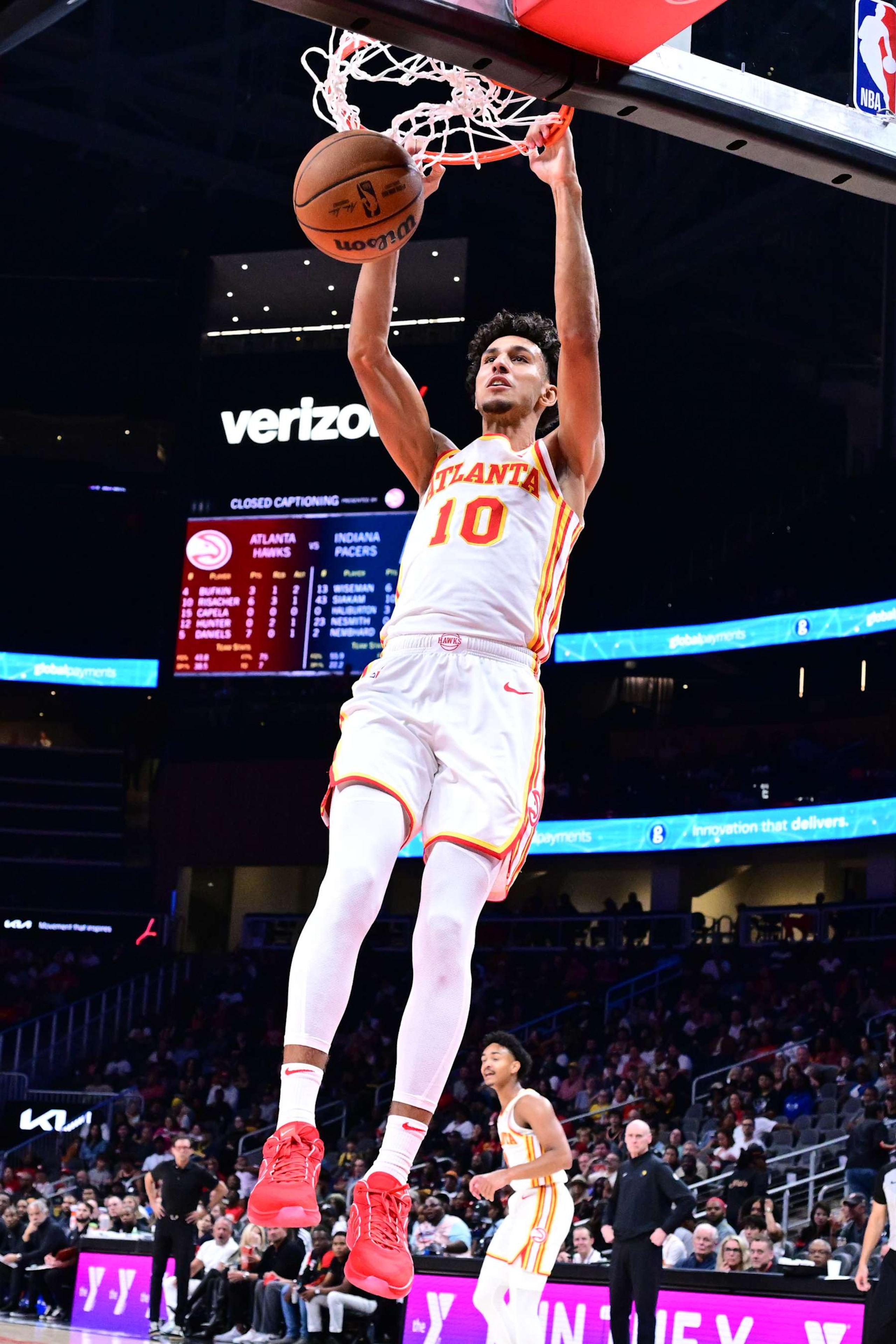 ATLANTA, GA - OCTOBER 8: Zaccharie Risacher #10 of the Atlanta Hawks dunks the ball during the game against the Indiana Pacers during a NBA preseason game on October 8, 2024 at State Farm Arena in Atlanta, Georgia.  NOTE TO USER: User expressly acknowledges and agrees that, by downloading and/or using this Photograph, user is consenting to the terms and conditions of the Getty Images License Agreement. Mandatory Copyright Notice: Copyright 2024 NBAE (Photo by Adam Hagy/NBAE via Getty Images)
