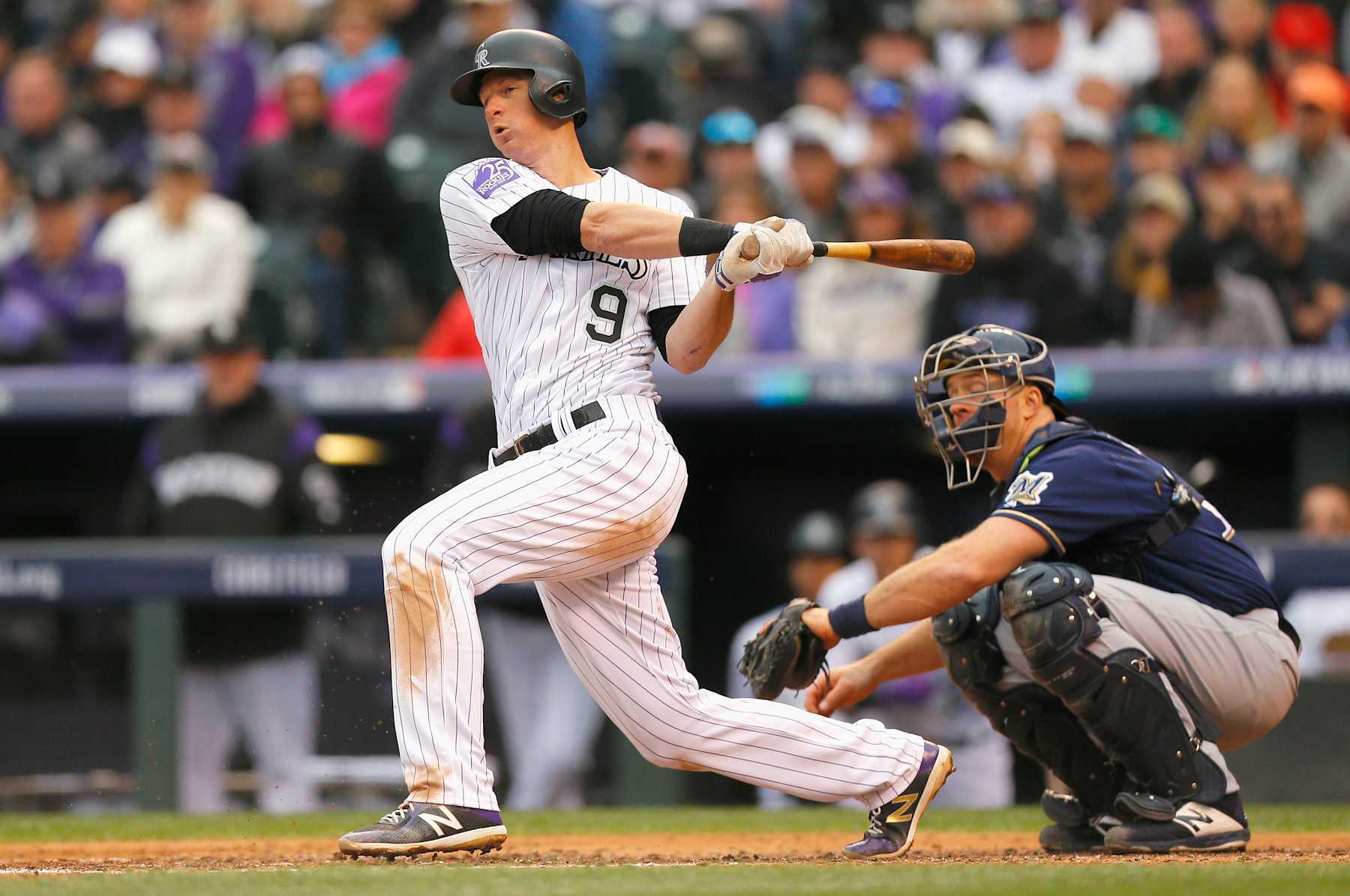 DENVER, CO - OCTOBER 07: DJ LeMahieu #9 of the Colorado Rockies hits a double in the third inning of Game Three of the National League Division Series against the Milwaukee Brewers at Coors Field on October 7, 2018 in Denver, Colorado. (Photo by Justin Edmonds/Getty Images)