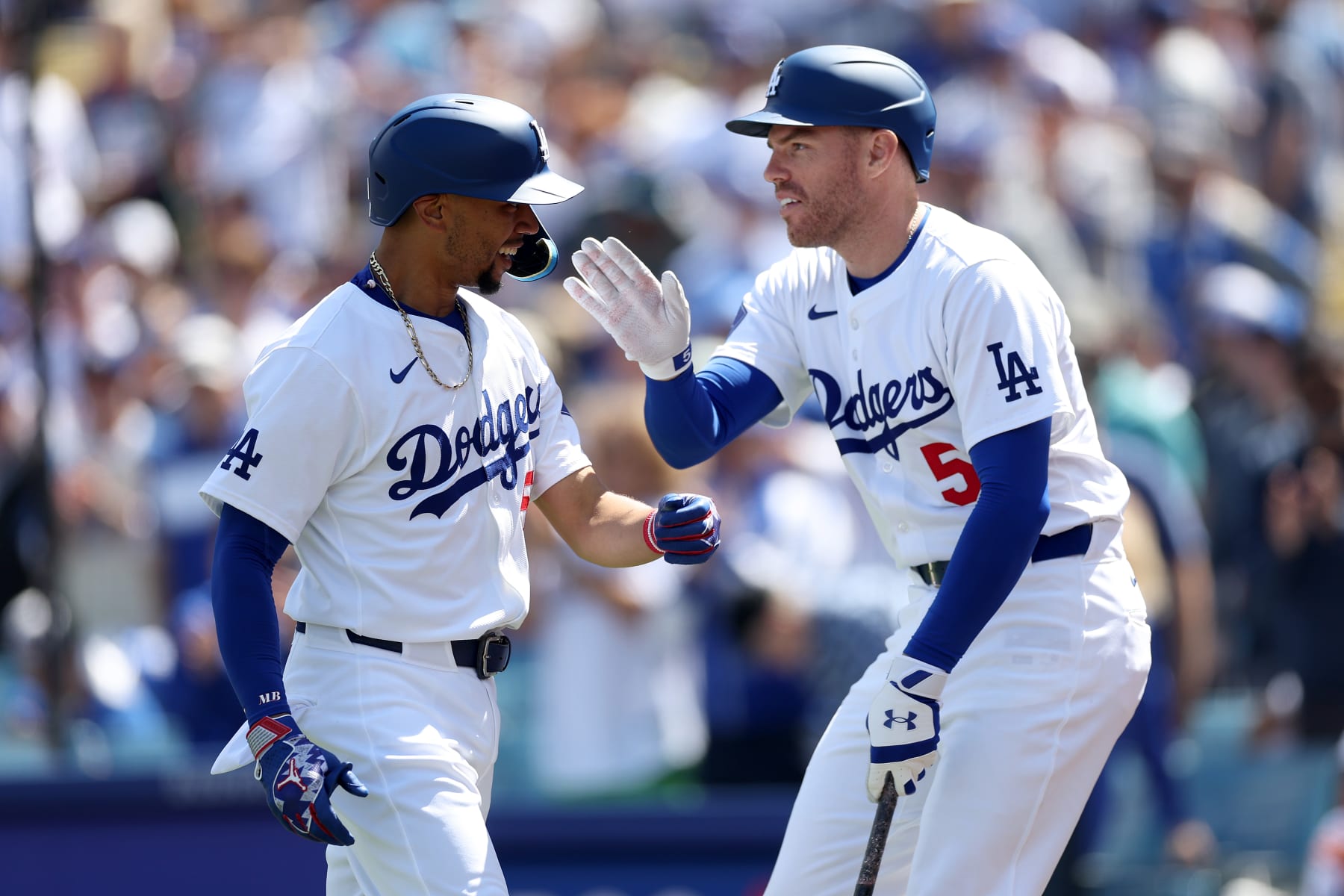 LOS ANGELES, CALIFORNIA - MARCH 28: Freddie Freeman #5 congratulates Mookie Betts #50 of the Los Angeles Dodgers after his solo homerun during the third inning of a game against the St. Louis Cardinals at Dodger Stadium on March 28, 2024 in Los Angeles, California. (Photo by Sean M. Haffey/Getty Images)