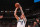 MIAMI, FL - APRIL 10:  Luka Doncic #77 of the Dallas Mavericks shoots a three point basket during the game against the Miami Heat on April 10, 2024 at Kaseya Center in Miami, Florida. NOTE TO USER: User expressly acknowledges and agrees that, by downloading and or using this Photograph, user is consenting to the terms and conditions of the Getty Images License Agreement. Mandatory Copyright Notice: Copyright 2024 NBAE (Photo by Issac Baldizon/NBAE via Getty Images)