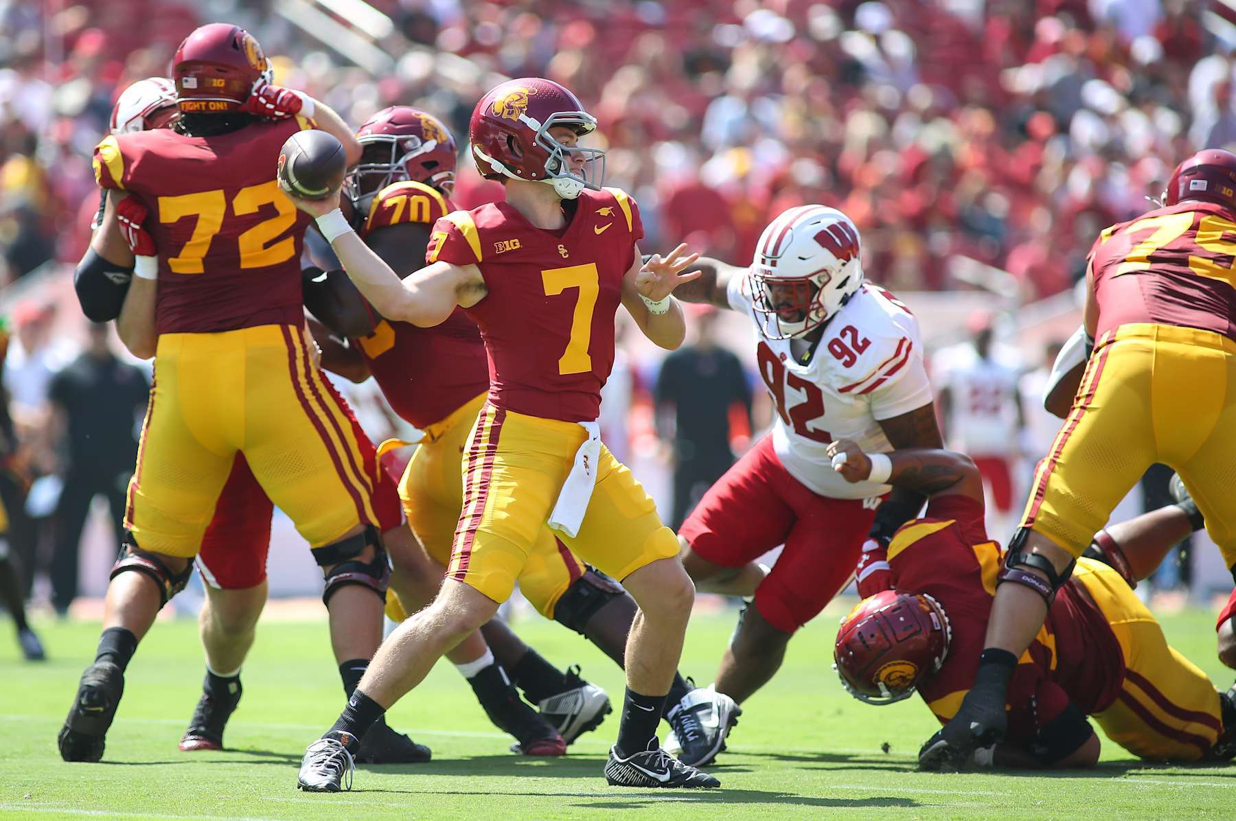 LOS ANGELES, CA - SEPTEMBER 28: USC Trojans quarterback Miller Moss (7) back to pass during the college football game between the Wisconsin Badgers and the USC Trojans on September 28, 2024, at the Los Angeles Memorial Coliseum in Los Angeles, CA.(Photo by Jevone Moore/Icon Sportswire via Getty Images)