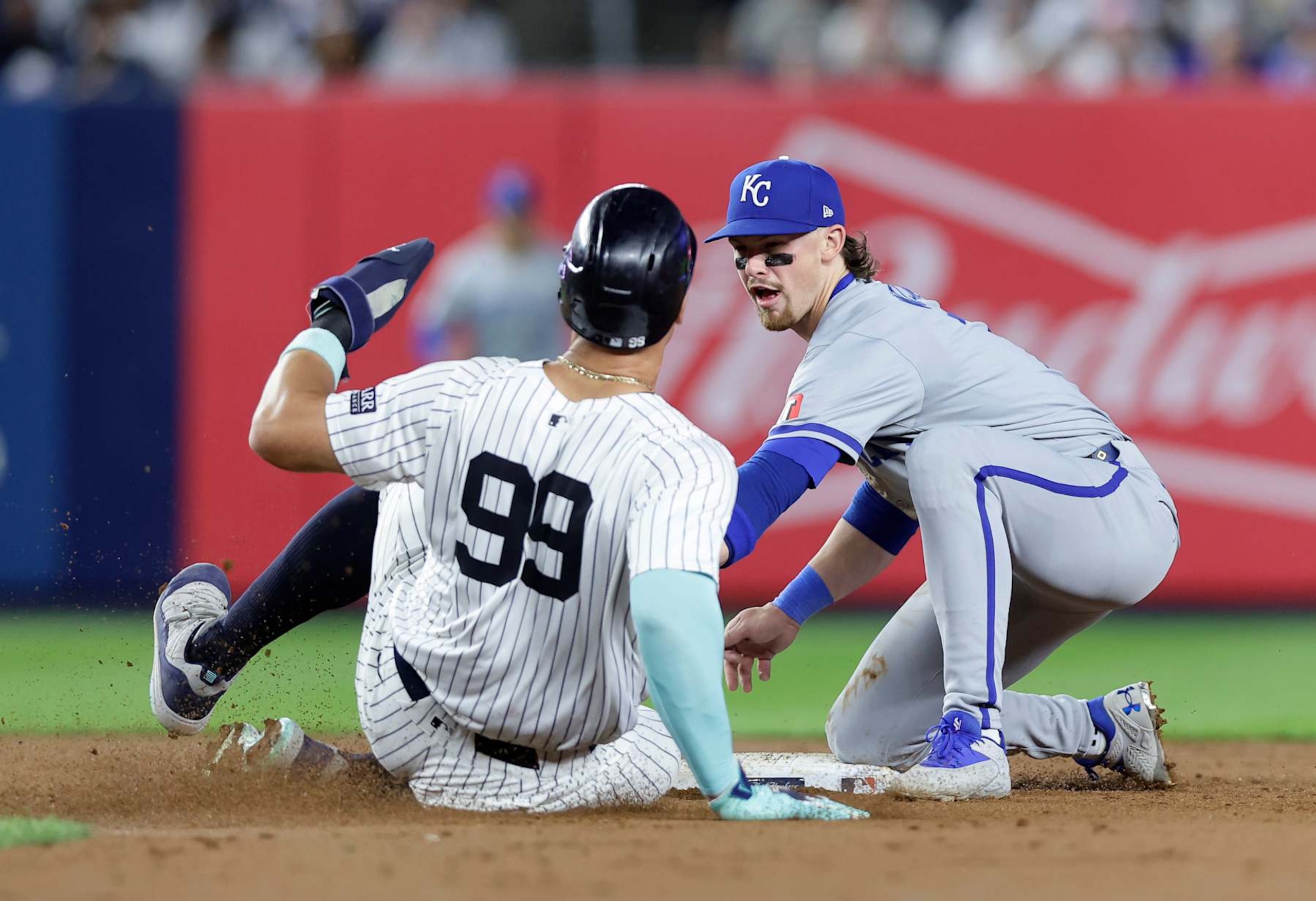 NEW YORK, NEW YORK - SEPTEMBER 09:  Bobby Witt Jr. #7 of the Kansas City Royals in action against Aaron Judge #99 of the New York Yankees at Yankee Stadium on September 09, 2024 in New York City. The Yankees defeated the Royals 10-4.  (Photo by Jim McIsaac/Getty Images)