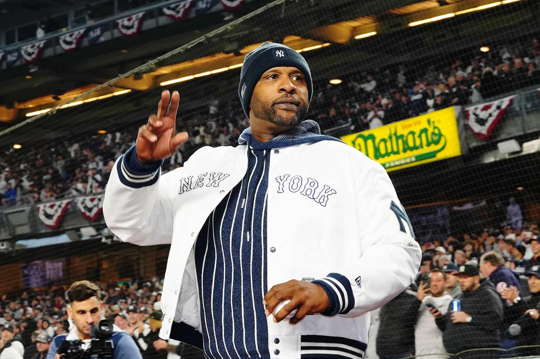 NEW YORK, NY - OCTOBER 14:  Former New York Yankees player CC Sabathia acknowledges the crowd prior to Game 1 of the ALCS presented by loanDepot between the Cleveland Guardians and the New York Yankees at Yankee Stadium on Monday, October 14, 2024 in New York, New York. (Photo by Mary DeCicco/MLB Photos via Getty Images)