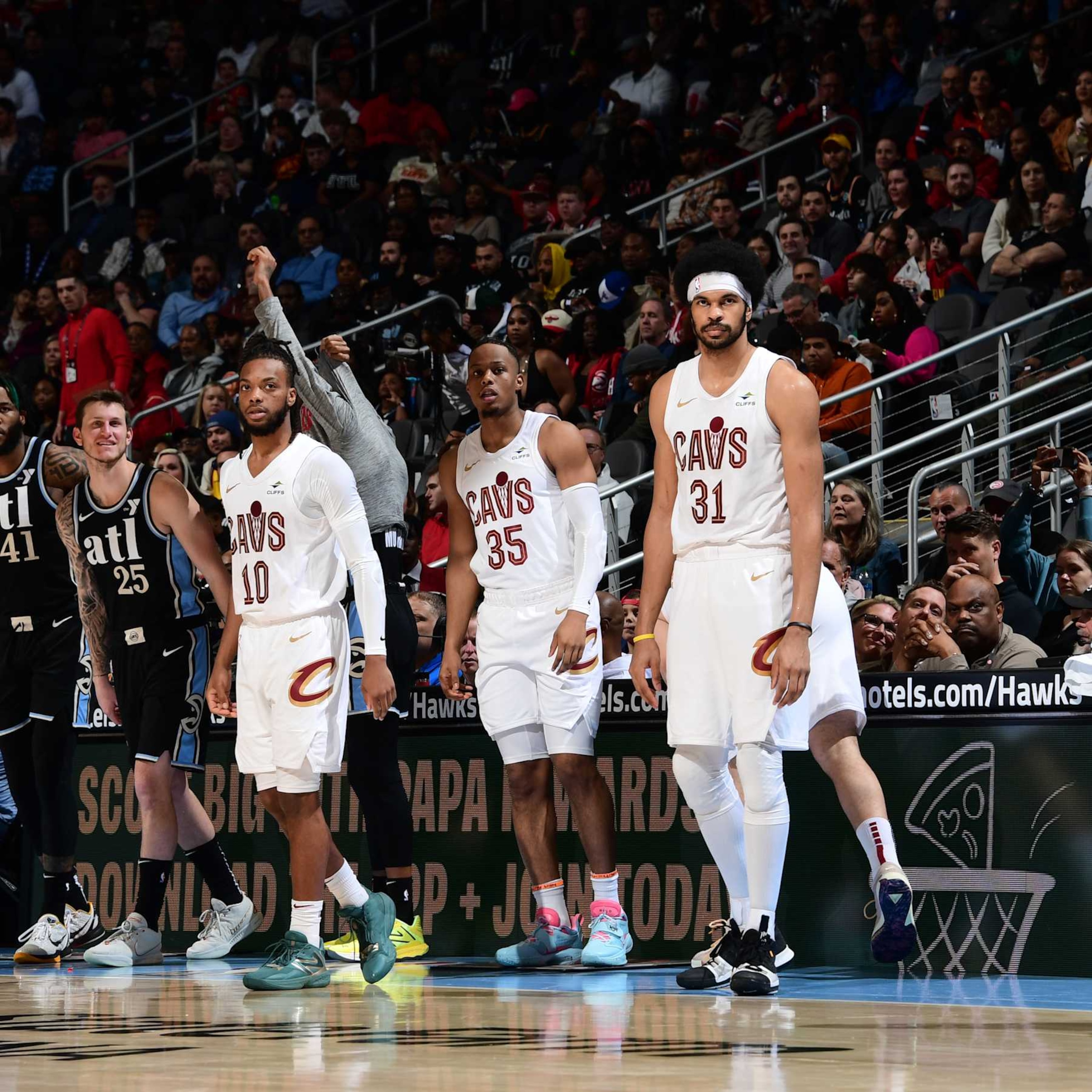 ATLANTA, GA - MARCH 6: Darius Garland #10, Isaac Okoro #35, and Jarrett Allen #31 of the Cleveland Cavaliers look on during the game against the Atlanta Hawks on March 6, 2024 at State Farm Arena in Atlanta, Georgia.  NOTE TO USER: User expressly acknowledges and agrees that, by downloading and/or using this Photograph, user is consenting to the terms and conditions of the Getty Images License Agreement. Mandatory Copyright Notice: Copyright 2024 NBAE (Photo by Scott Cunningham/NBAE via Getty Images)