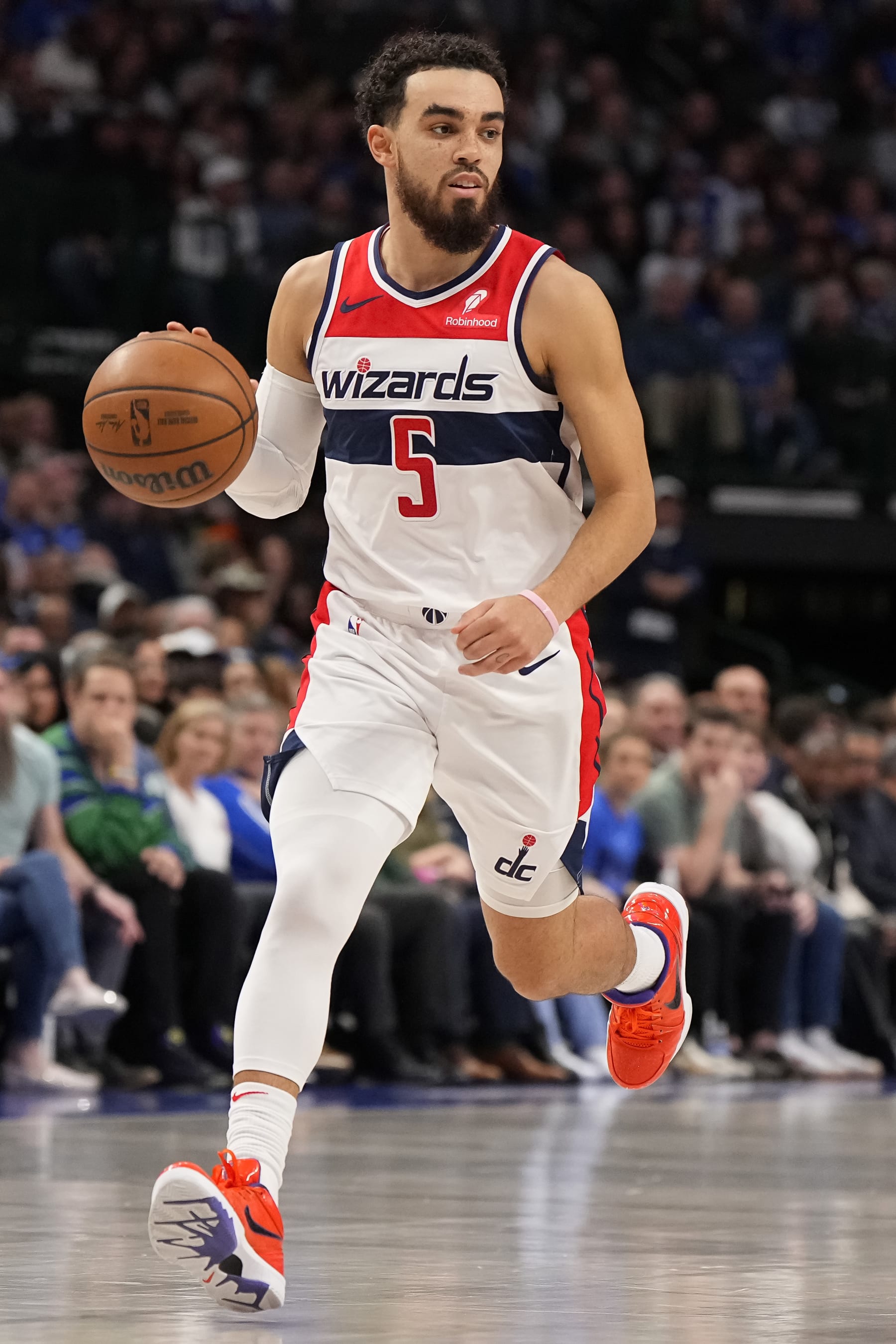 DALLAS, TEXAS - FEBRUARY 12: Tyus Jones #5 of the Washington Wizards brings the ball up court during the first half against the Dallas Mavericks at American Airlines Center on February 12, 2024 in Dallas, Texas. NOTE TO USER: User expressly acknowledges and agrees that, by downloading and or using this photograph, User is consenting to the terms and conditions of the Getty Images License Agreement. (Photo by Sam Hodde/Getty Images)