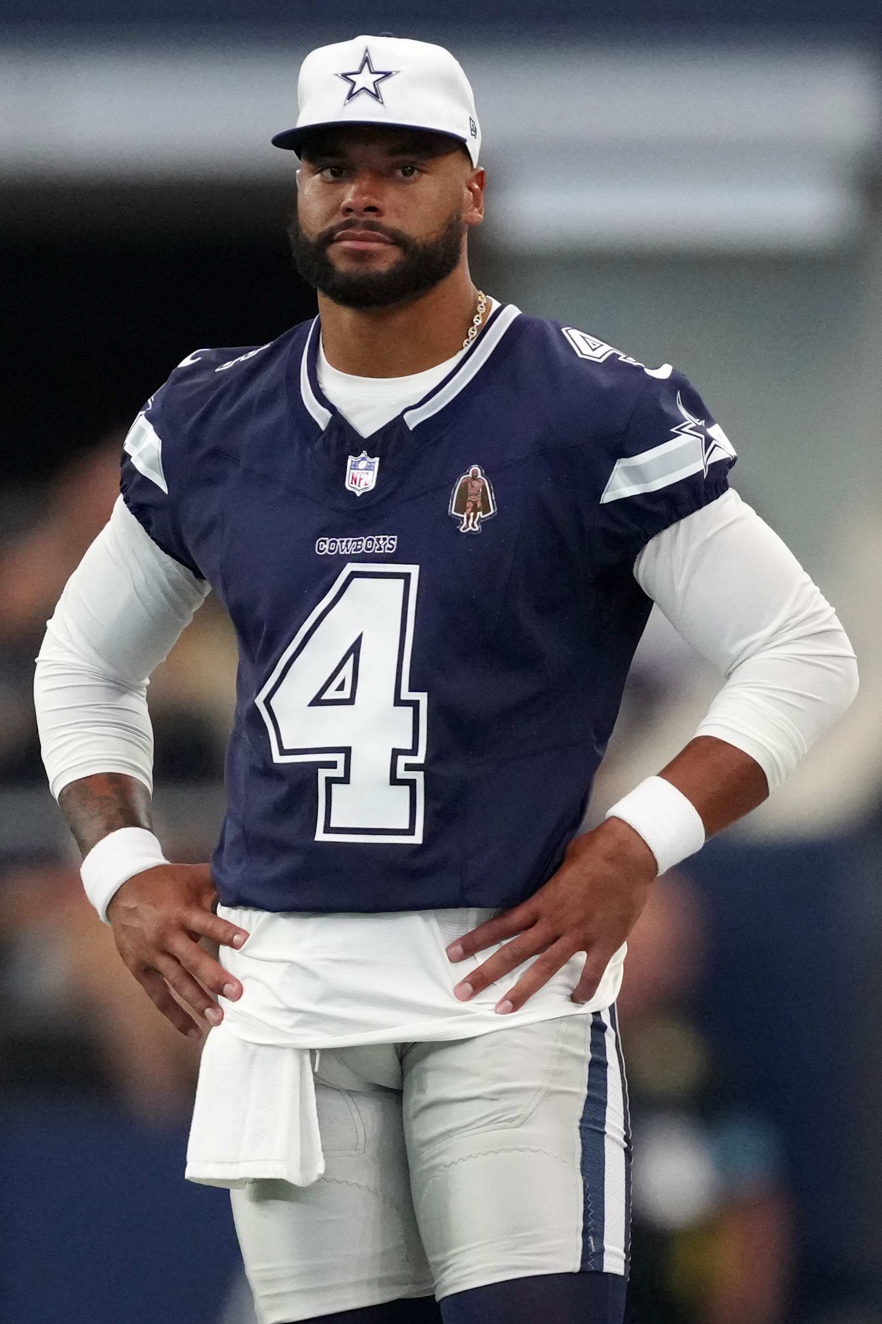 ARLINGTON, TEXAS - AUGUST 24: Dak Prescott #4 of the Dallas Cowboys looks on from the sideline during the first half of a preseason game against the Los Angeles Chargers at AT&T Stadium on August 24, 2024 in Arlington, Texas. (Photo by Sam Hodde/Getty Images)