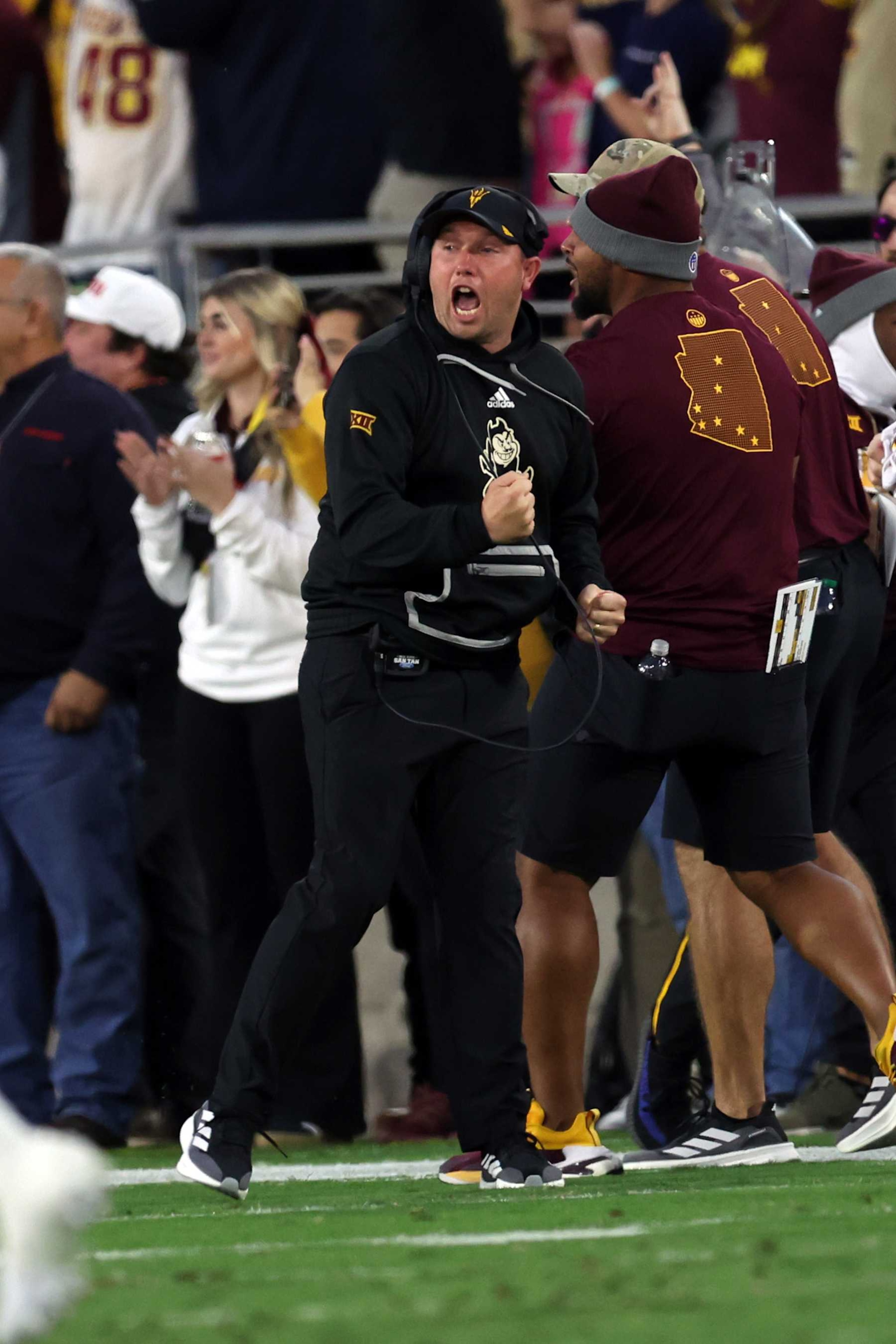 TEMPE, ARIZONA - NOVEMBER 09: Head coach Kenny Dillingham of the Arizona State Sun Devils reacts after a blocked punt was returned for a touchdown by defensive back Montana Warren #9 during the first half against the UCF Knights at Sun Devil Stadium on November 09, 2024 in Tempe, Arizona. (Photo by Chris Coduto/Getty Images) TEMPE, ARIZONA - NOVEMBER 09: Head coach Kenny Dillingham of the Arizona State Sun Devils reacts after a blocked punt was returned for a touchdown by defensive back Montana Warren #9 during the first half against the UCF Knights at Sun Devil Stadium on November 09, 2024 in Tempe, Arizona. (Photo by Chris Coduto/Getty Images)