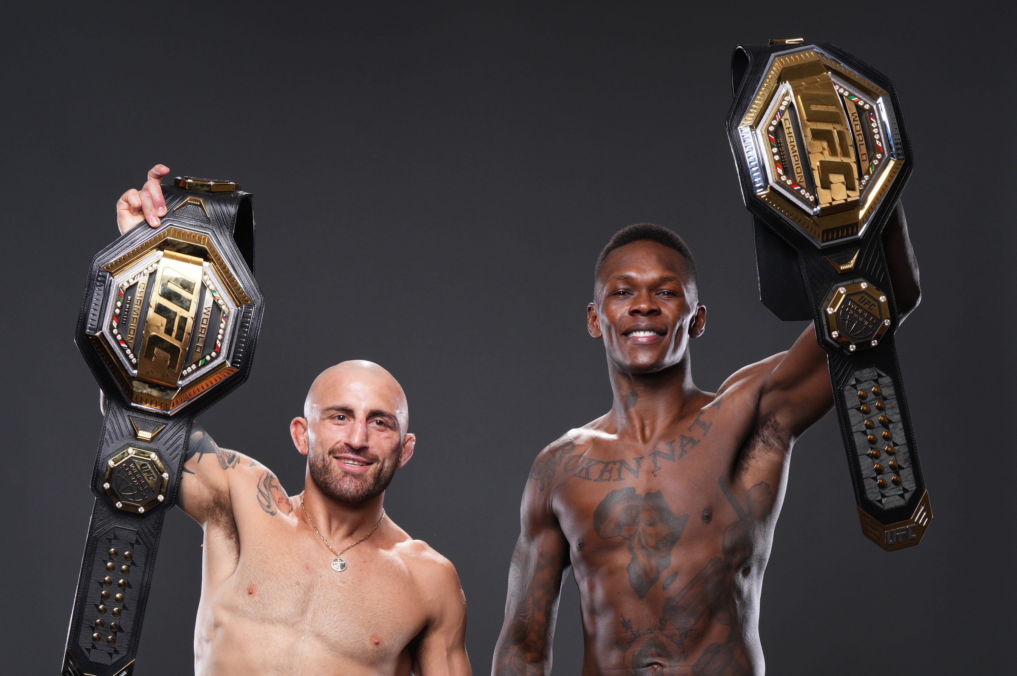LAS VEGAS, NEVADA - JULY 02: Israel Adesanya of Nigeria and Alexander Volkanovski of Australia pose for a portrait after their victorys during the UFC 276 event at T-Mobile Arena on July 02, 2022 in Las Vegas, Nevada. (Photo by Mike Roach/Zuffa LLC)