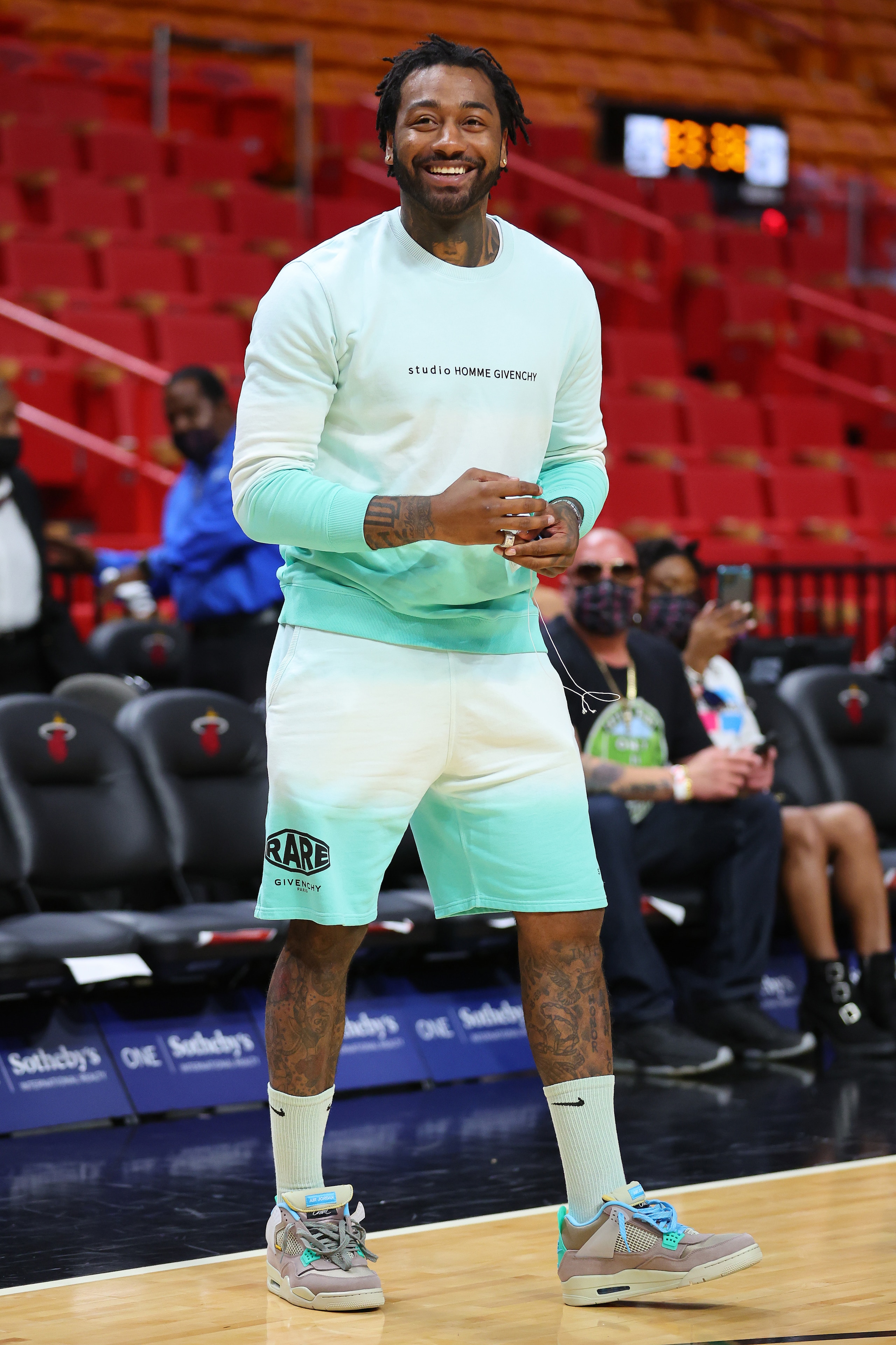 MIAMI, FLORIDA - MARCH 07: John Wall #1 of the Houston Rockets laughs prior to the game against the Miami Heat at FTX Arena on March 07, 2022 in Miami, Florida. NOTE TO USER: User expressly acknowledges and agrees that, by downloading and or using this photograph, User is consenting to the terms and conditions of the Getty Images License Agreement. (Photo by Michael Reaves/Getty Images)
