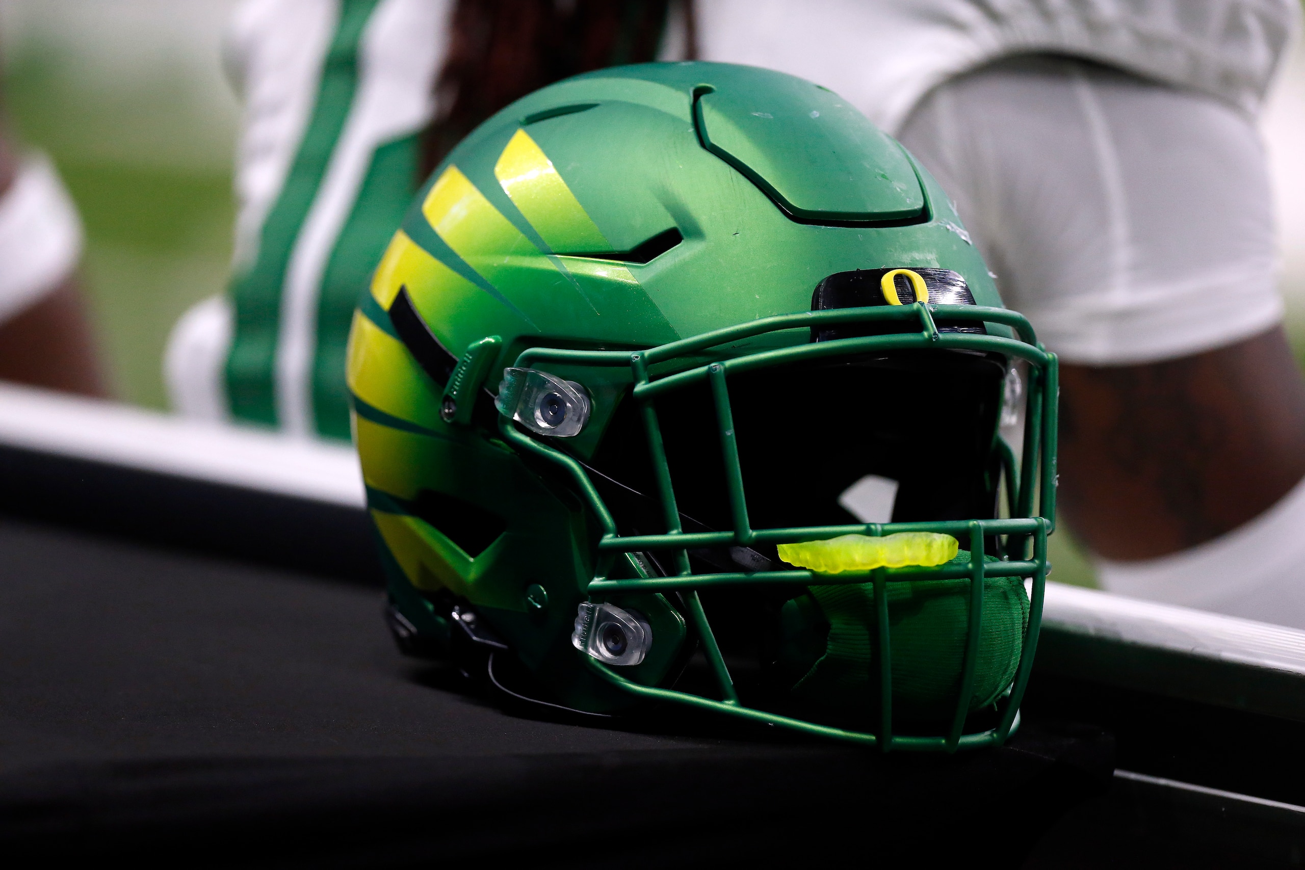 SAN ANTONIO, TX - DECEMBER 29: An Oregon Ducks helmet rests on the bench during the game against the Oklahoma Sooners during the Valero Alamo Bowl football game at the Alamodome on December 29, 2021 in San Antonio, TX. (Photo by Adam Davis/Icon Sportswire via Getty Images)