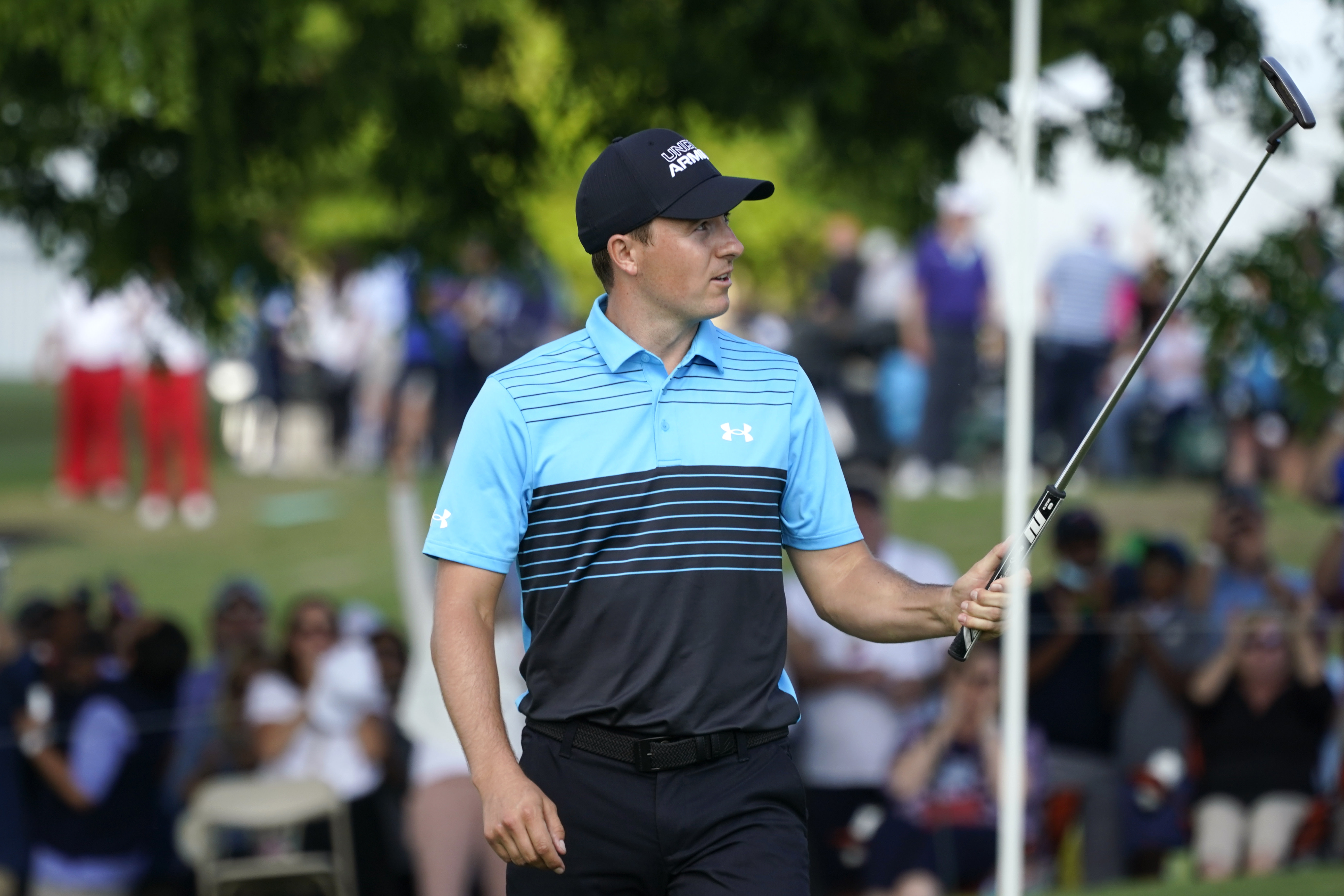 Jordan Spieth reacts after making an eagle putt on the 18th green during the first round of the AT&T Byron Nelson golf tournament, Thursday, May 13, 2021, in McKinney, Texas. (AP Photo/Tony Gutierrez)