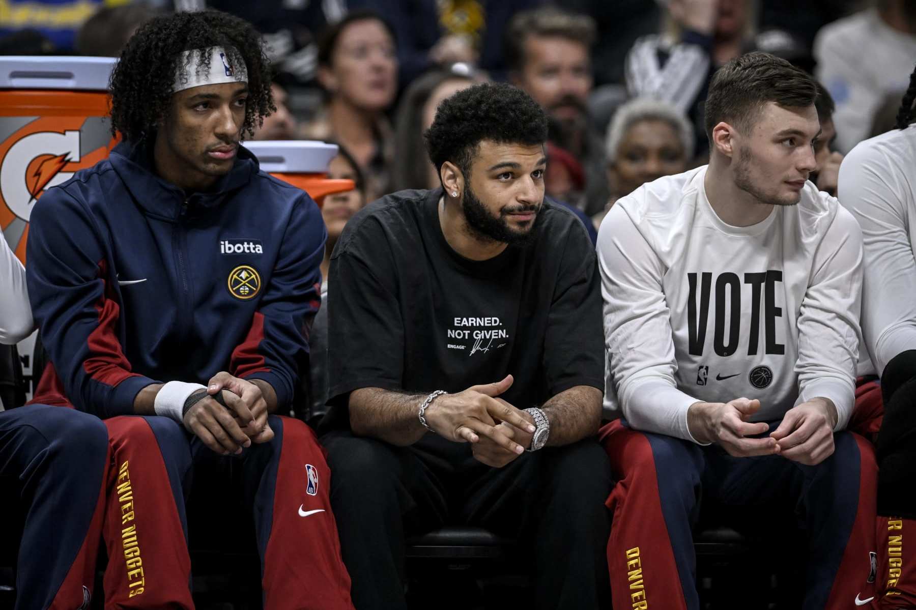 DENVER, CO - NOVEMBER 6: Zeke Nnaji (22), Jamal Murray (27) and Christian Braun (0) of the Denver Nuggets sit on the bench during the first quarter against the New Orleans Pelicans at Ball Arena in Denver on Monday, November 6, 2023. (Photo by AAron Ontiveroz/The Denver Post)